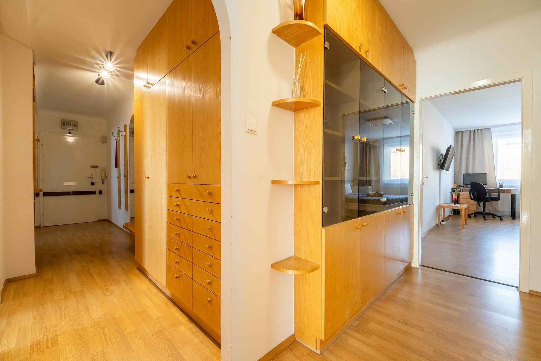 Hallway with Floor-to-Ceiling Cabinetry - Smart Storage and Classic Charm Welcome You into the Home