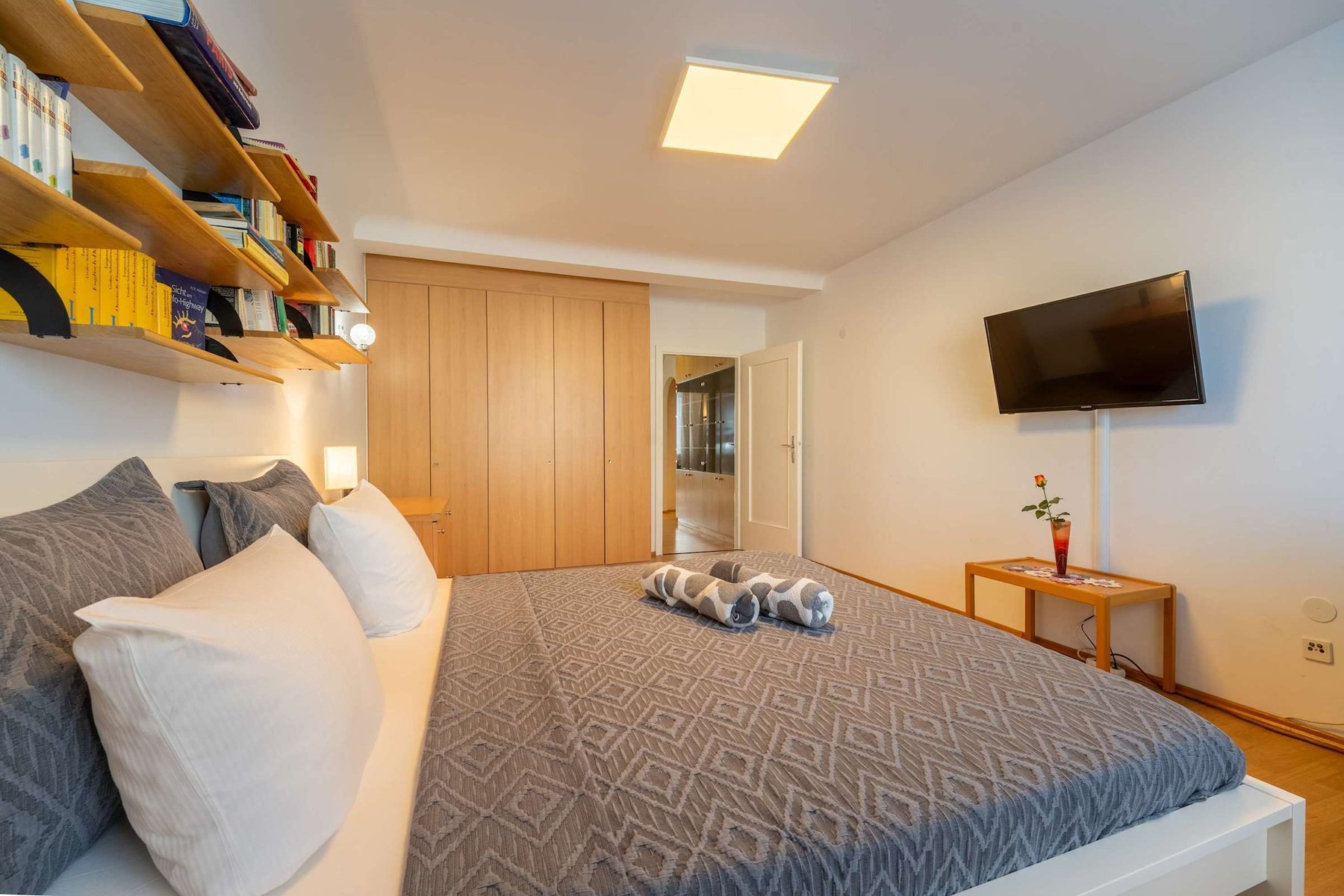 
Master Bedroom Alternate Angle - Built-In Storage and Book Collection Add Warmth & Functionality