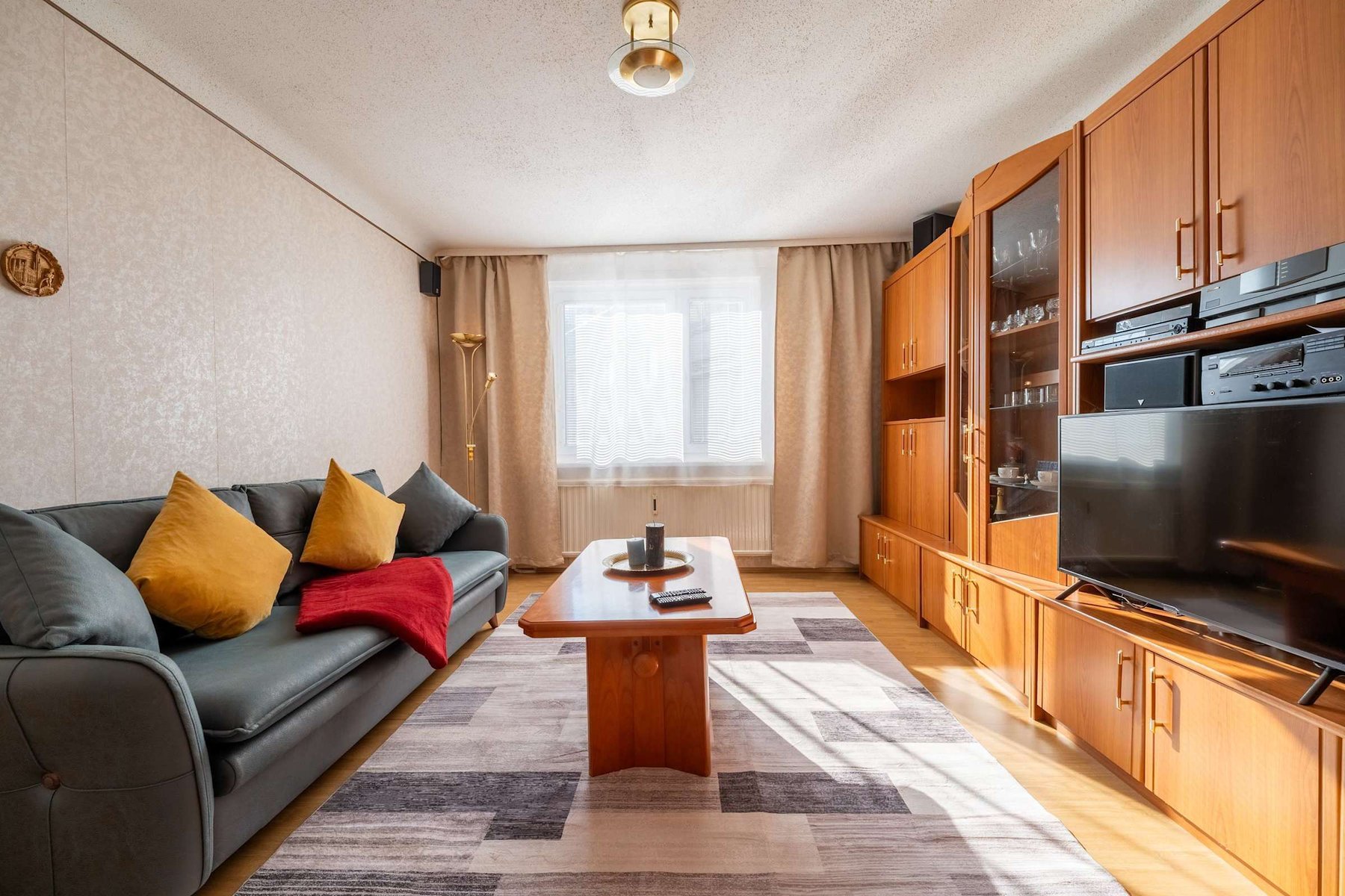 Cozy Living Room with Plush Seating & Smart Entertainment - Ideal for Evenings In or Movie Nights