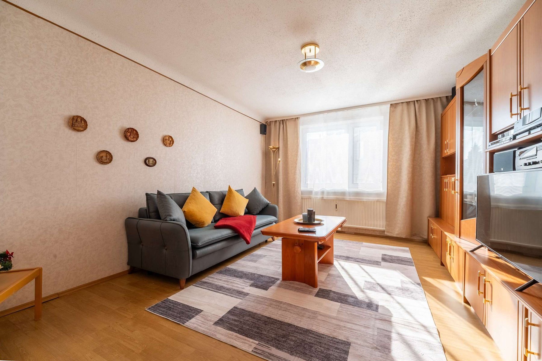 Cozy Living Room with Plush Seating & Smart Entertainment - Ideal for Evenings In or Movie Nights