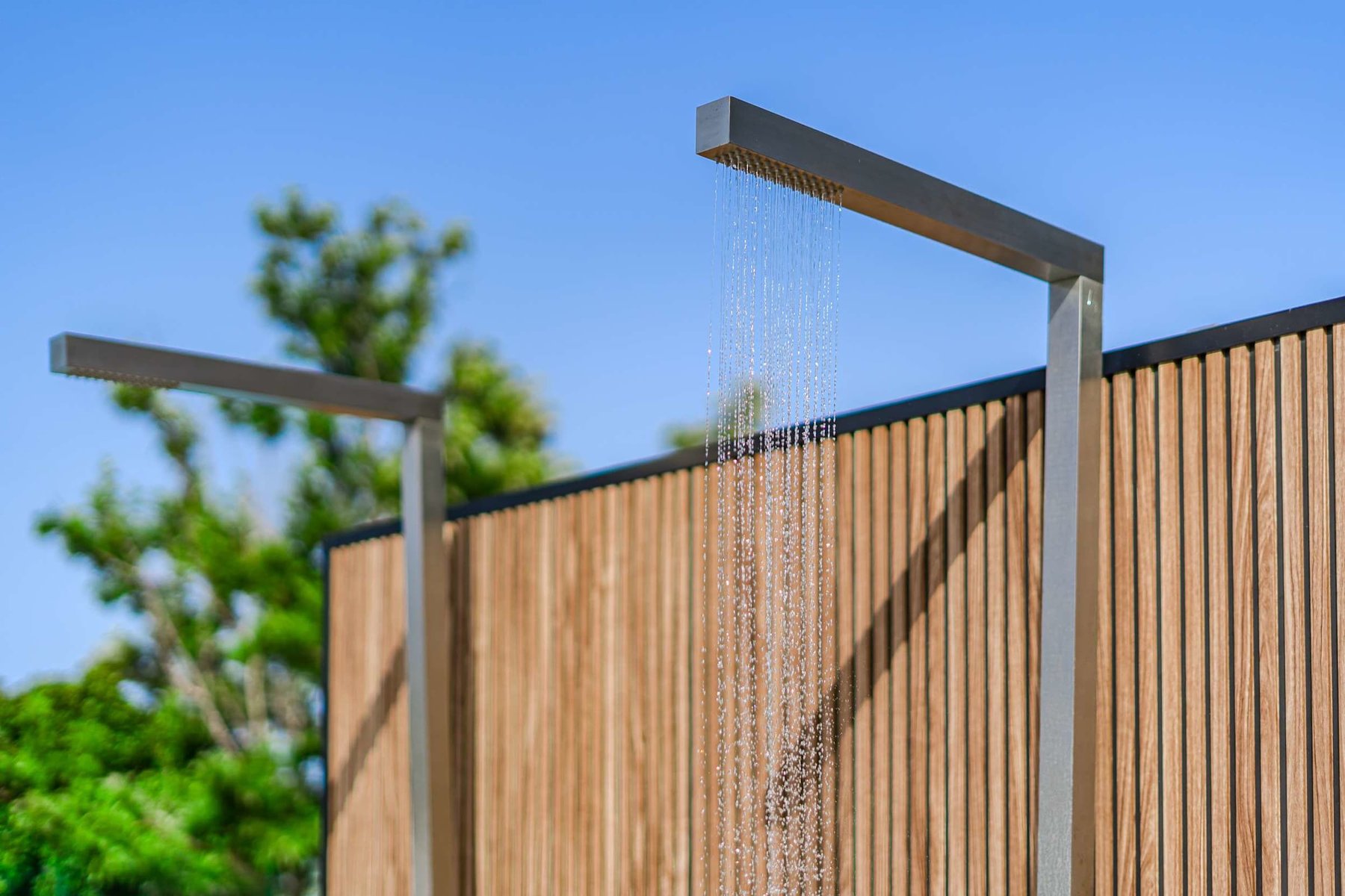 Resort-Style Pool Area with Sun Loungers and Open-Air Relaxation Space