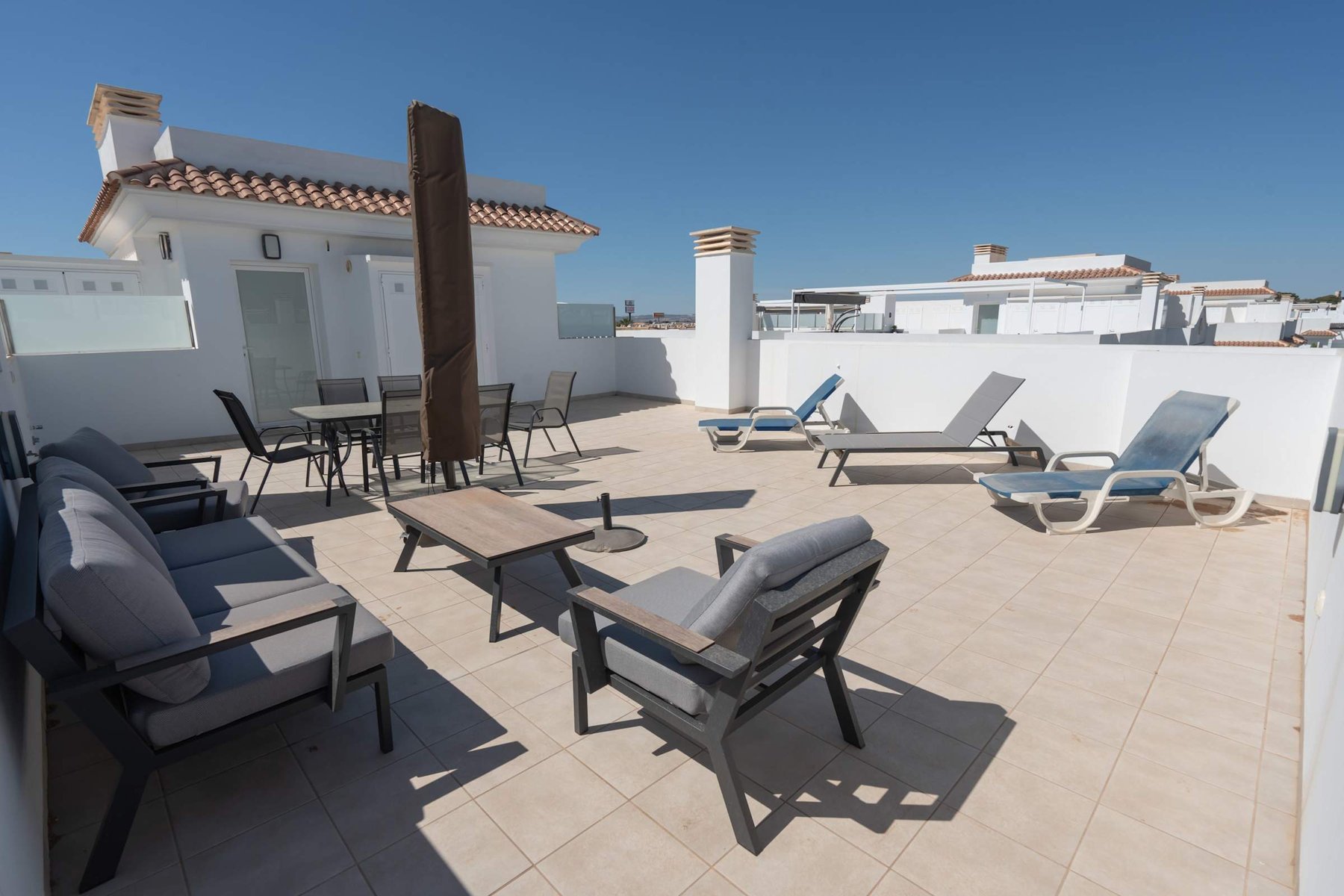 Terrace with Dining table, Sun loungers and Sun Umbrella