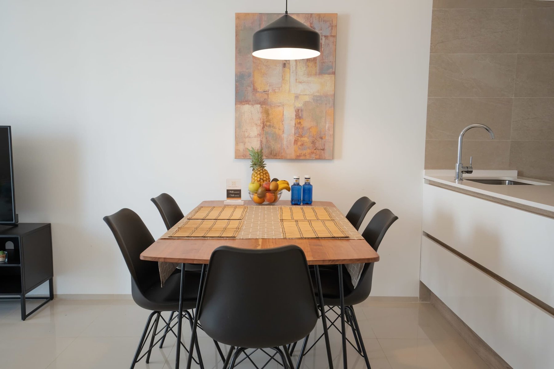 Kitchen with Dining Table, Oven, Stovetop, Microwave, Dishwasher, Fridge and Toaster