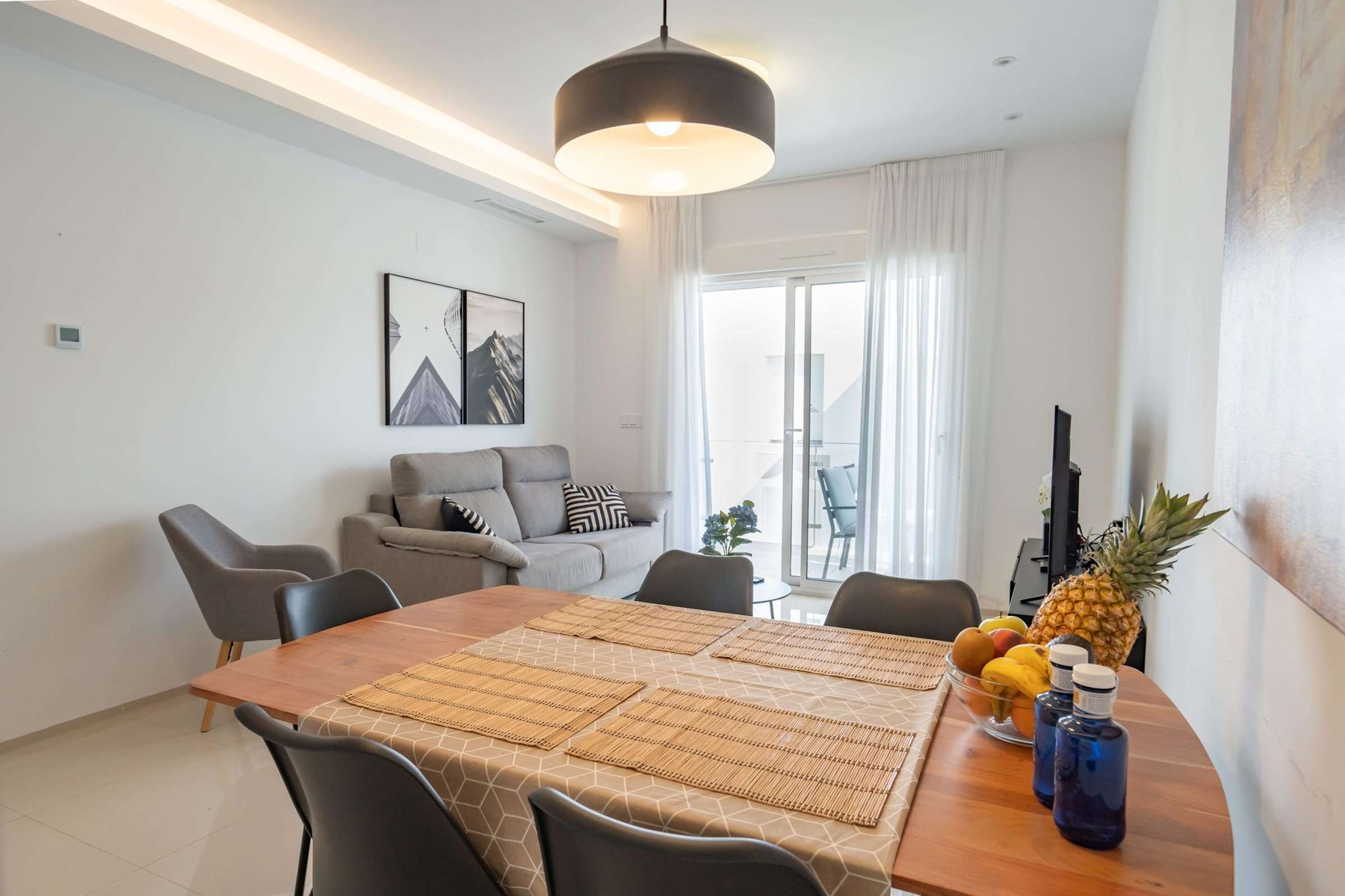 Kitchen with Dining Table, Oven, Stovetop, Microwave, Dishwasher, Fridge and Toaster