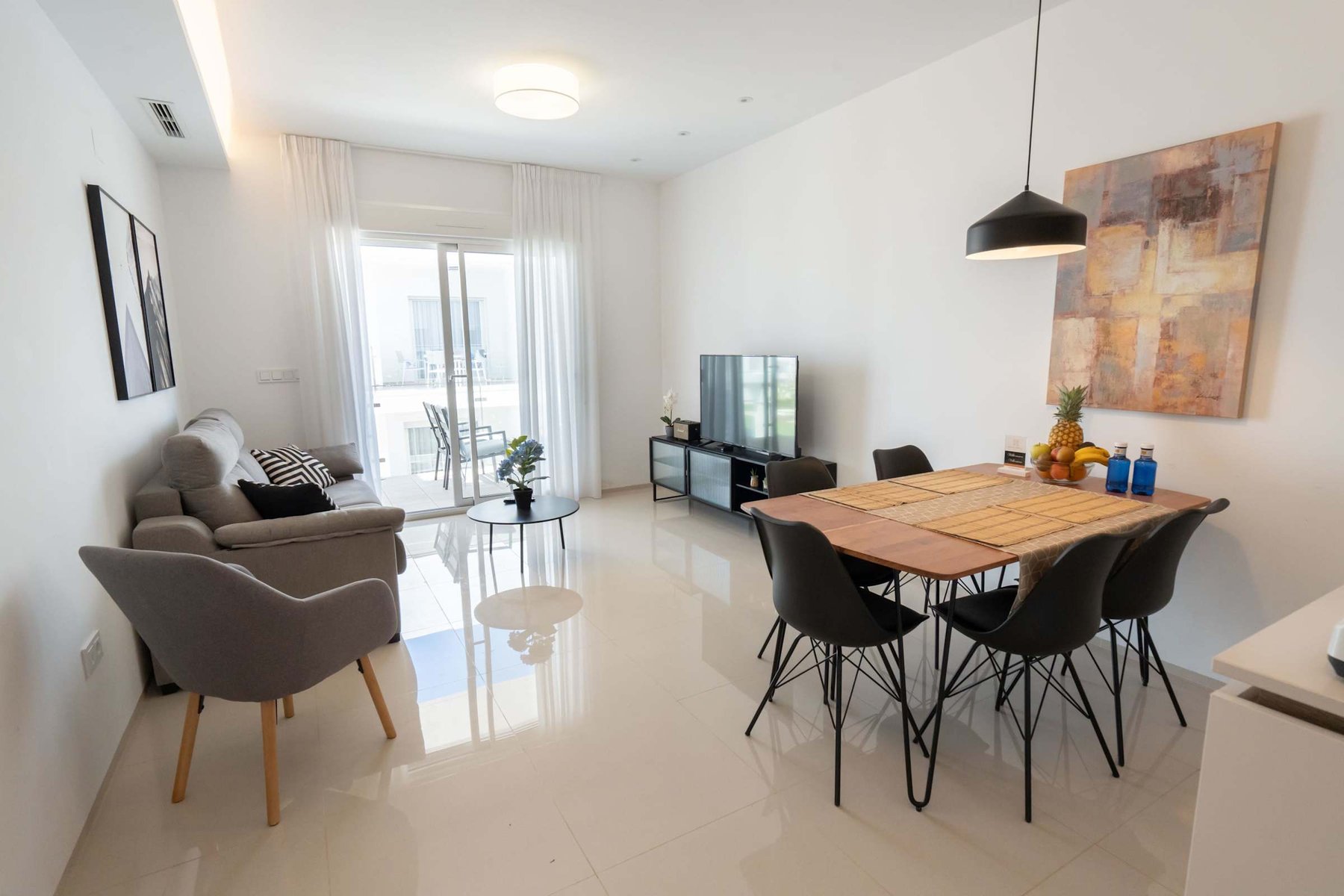 Kitchen with Dining Table, Oven, Stovetop, Microwave, Dishwasher, Fridge and Toaster