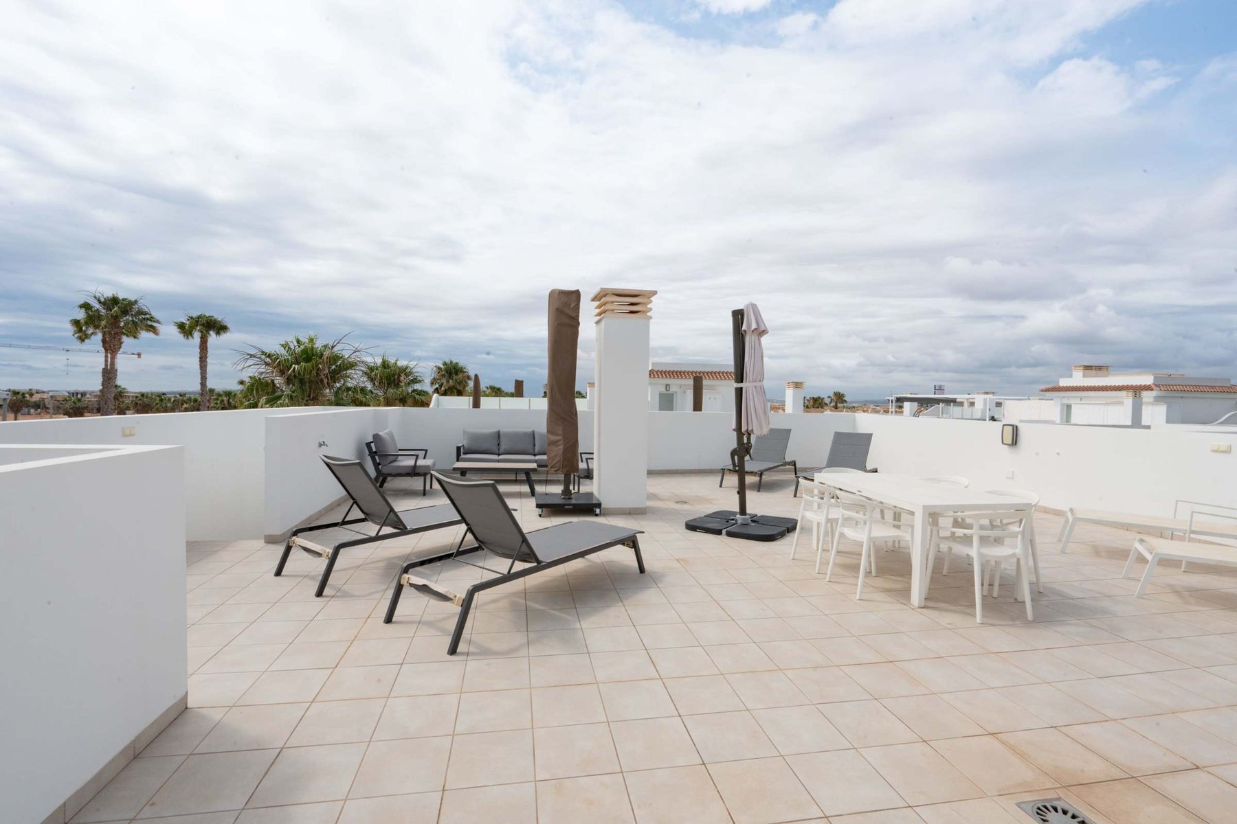 Terrace with Dining Table, Seating Area, Sun Loungers and Sun Umbrella