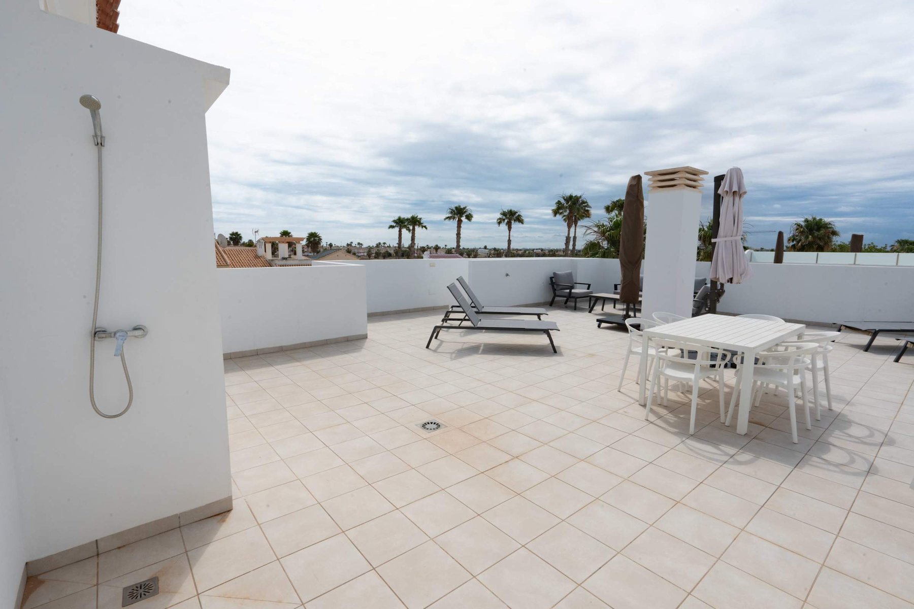 Terrace with Dining Table, Seating Area, Sun Loungers and Sun Umbrella
