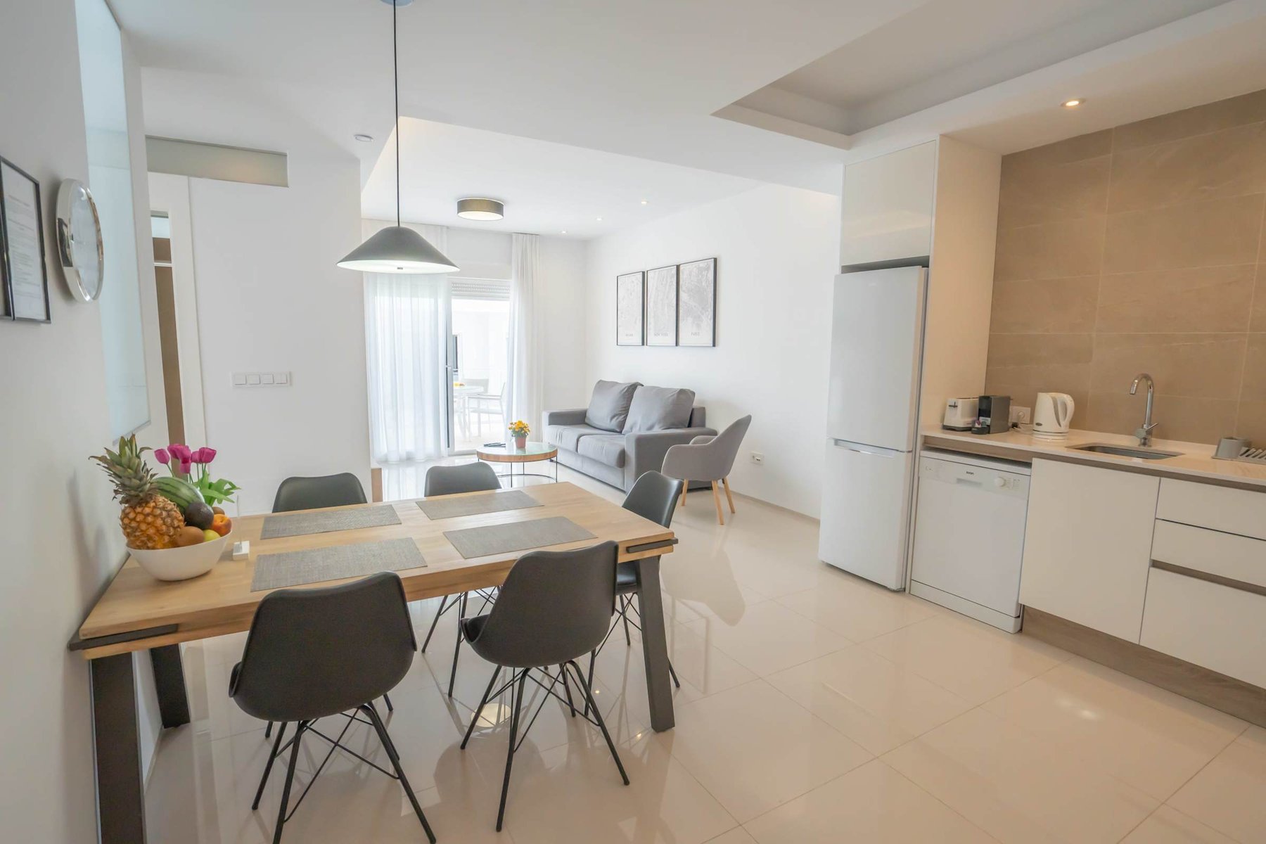 Kitchen with Dining Table, Oven, Stovetop, Microwave, Dishwasher, Fridge and Toaster