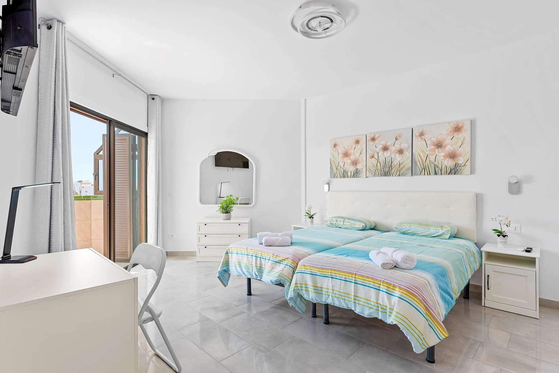 Bedroom with two Single Beds, Desk, Flatscreen TV, Wardrobe and Balcony Access