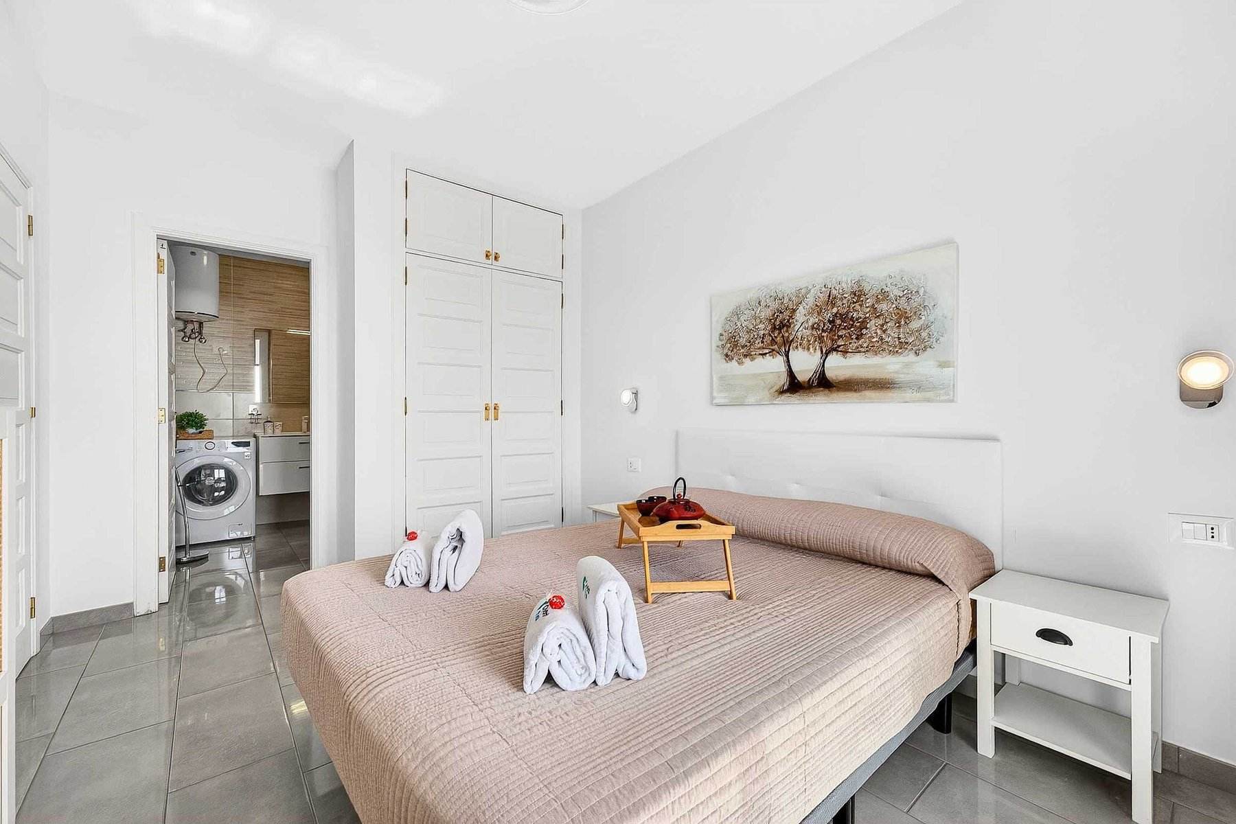 Bedroom with Queen Bed, Flatscreen TV, Wardrobe and Balcony Access