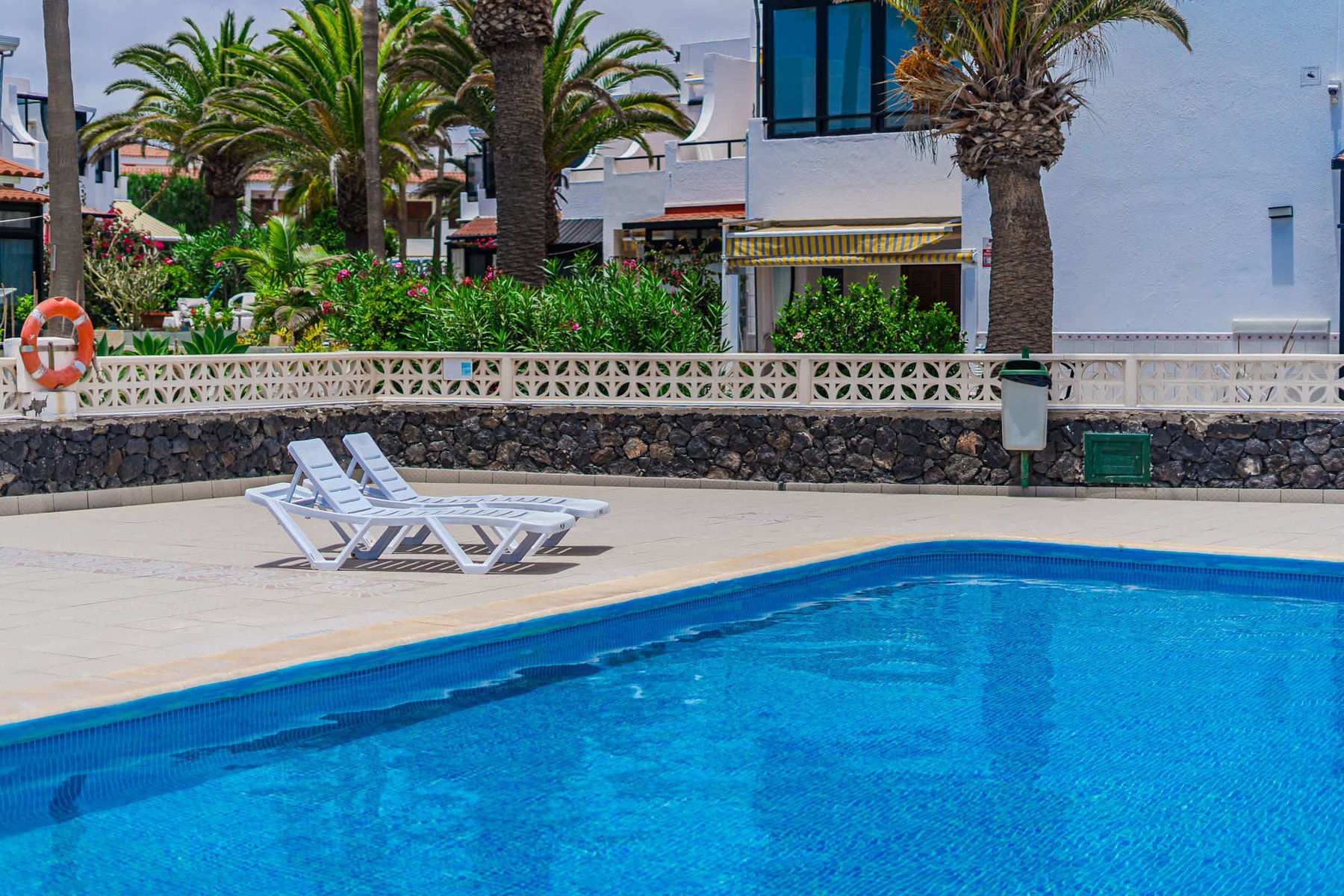 Year-Round Pool Area with Ocean Views & Sunbeds 