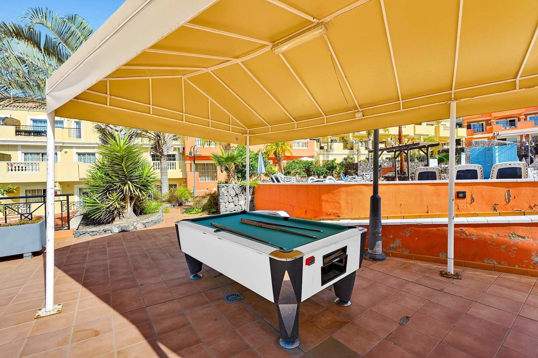 Covered Outdoor Billiards Area for Relaxed Resort Entertainment