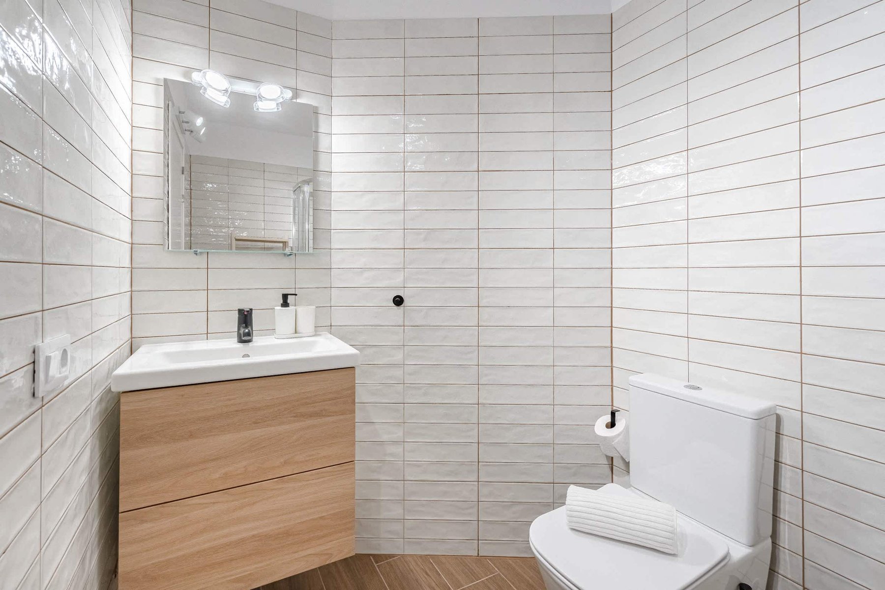 Bathroom with Shower, Sink, Toilet, Towels and Essentials