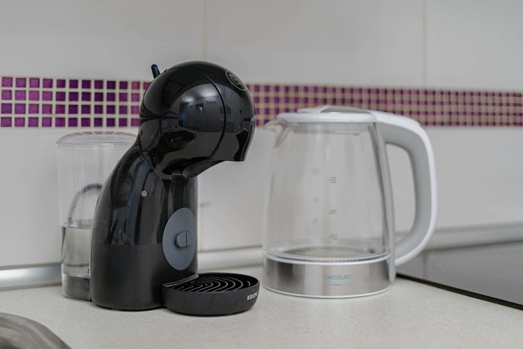 Kitchen with Coffee Maker, Toaster, Electric Kettle, Microwave, Oven, Stovetop, Dishwasher and Fridge