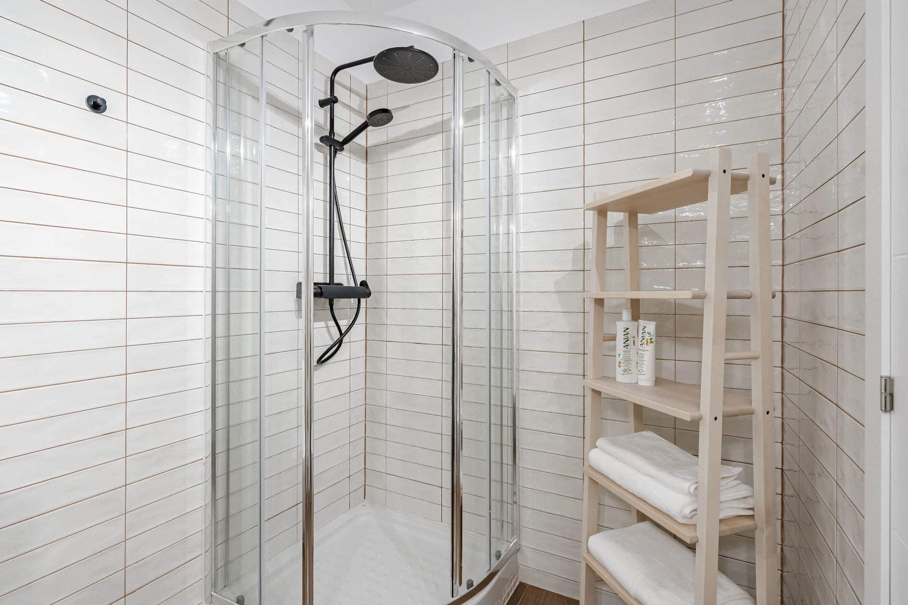 Bathroom with Shower, Sink, Toilet, Towels and Essentials