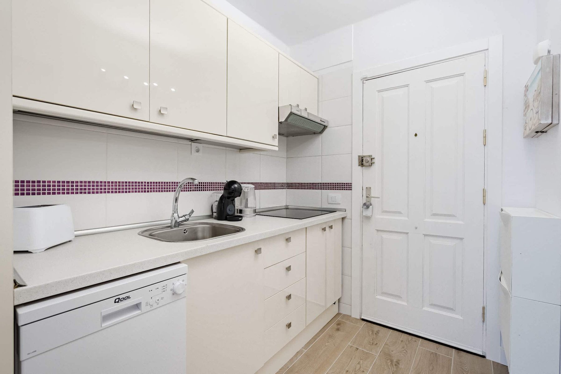 Kitchen with Coffee Maker, Toaster, Electric Kettle, Microwave, Oven, Stovetop, Dishwasher and Fridge