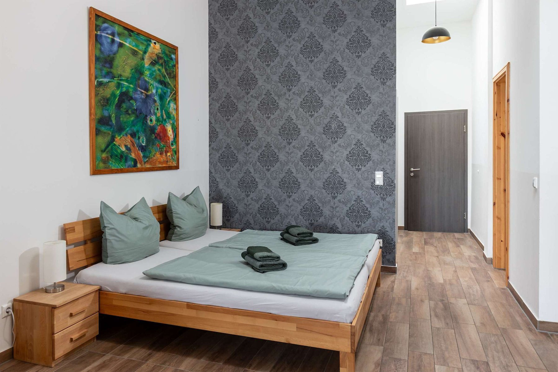 Living Area with a Double Bed, Dining Table & Sofa Bed