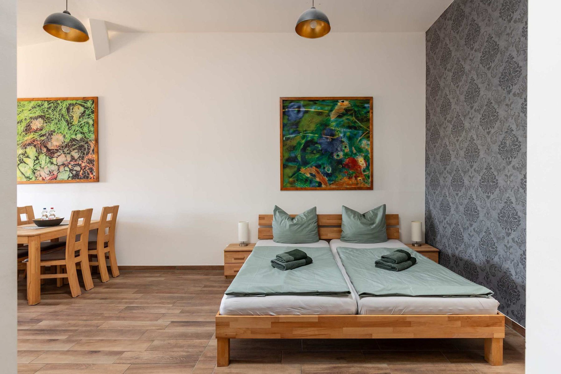 Living Area with a Double Bed, Dining Table & Sofa Bed