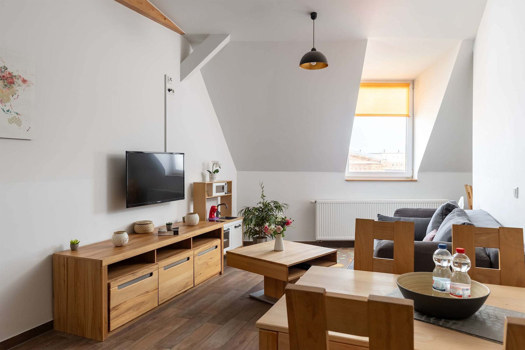 Living Area with a Dining Table, Sofa Bed, TV & Kids Play Corner