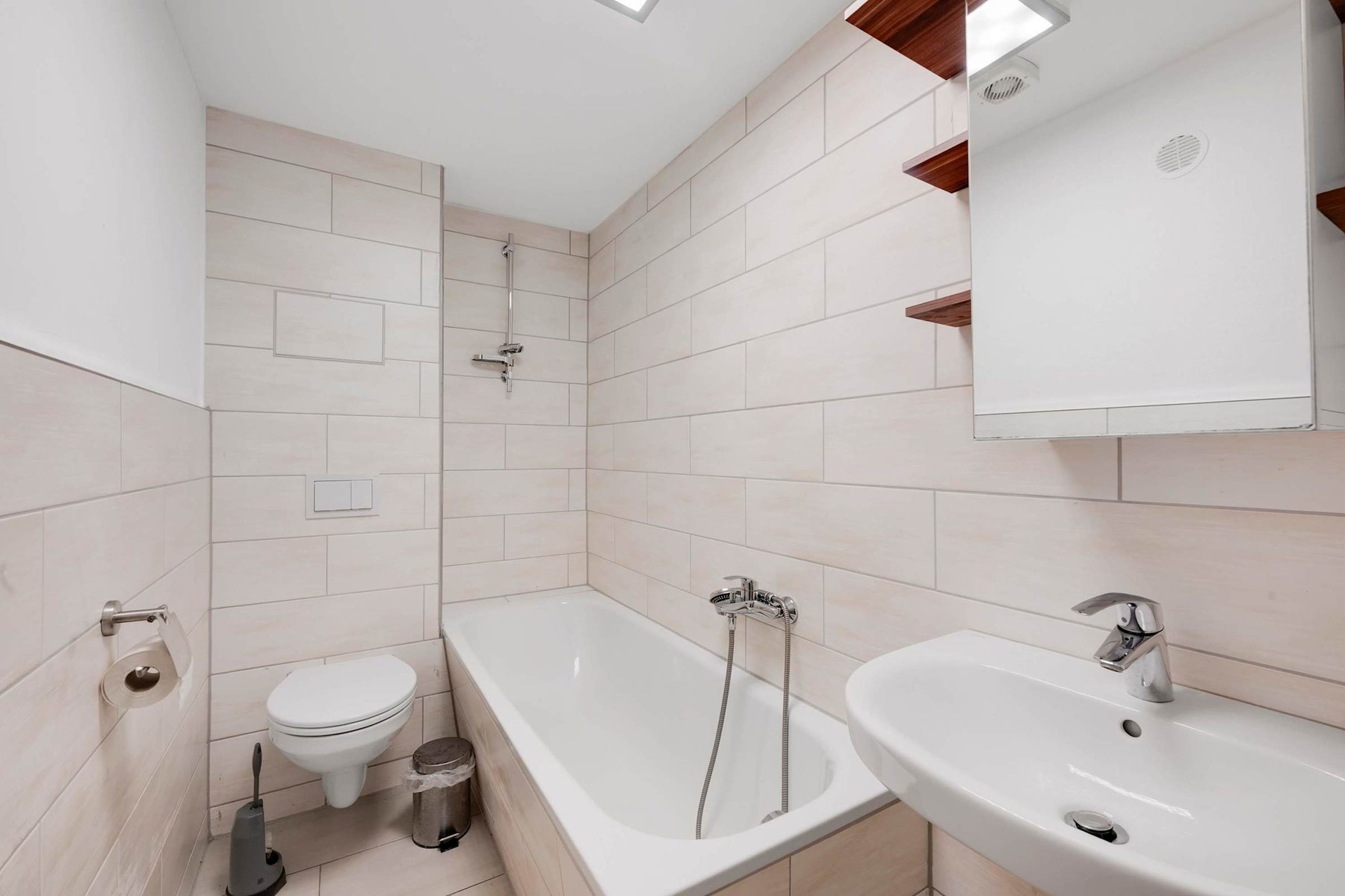 Modern Bathroom with Tub, Shower, and fresh Neutral Tiles.