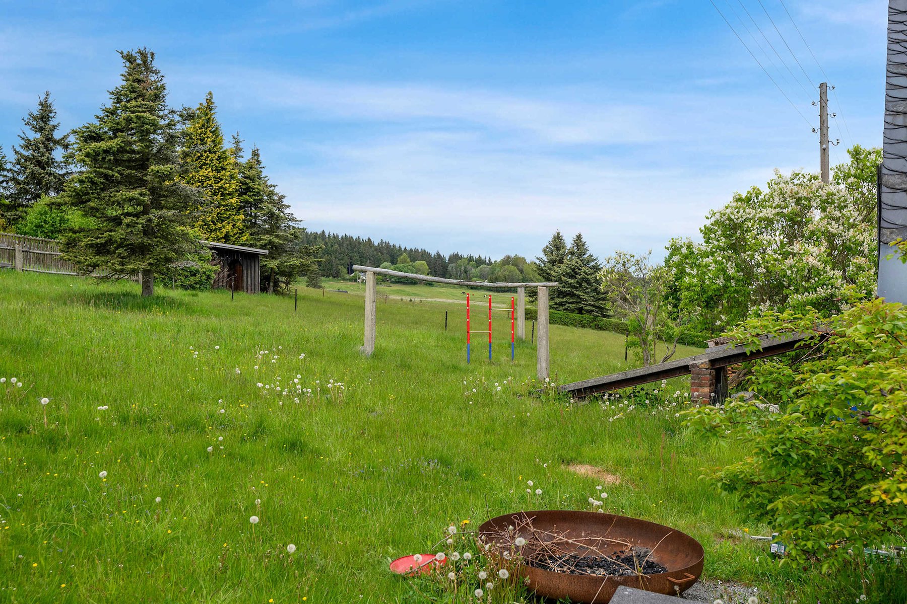 Enjoy a Cozy Fire-Pit and Children's Play Zone in the Large Backyard with open Mountain Views.
