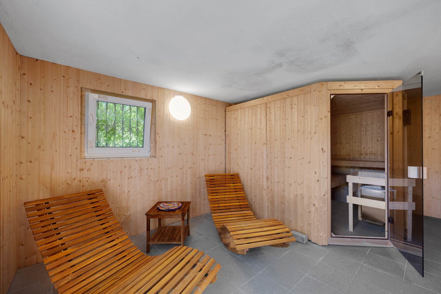 Cozy Sauna Relaxation Area With Wooden Loungers