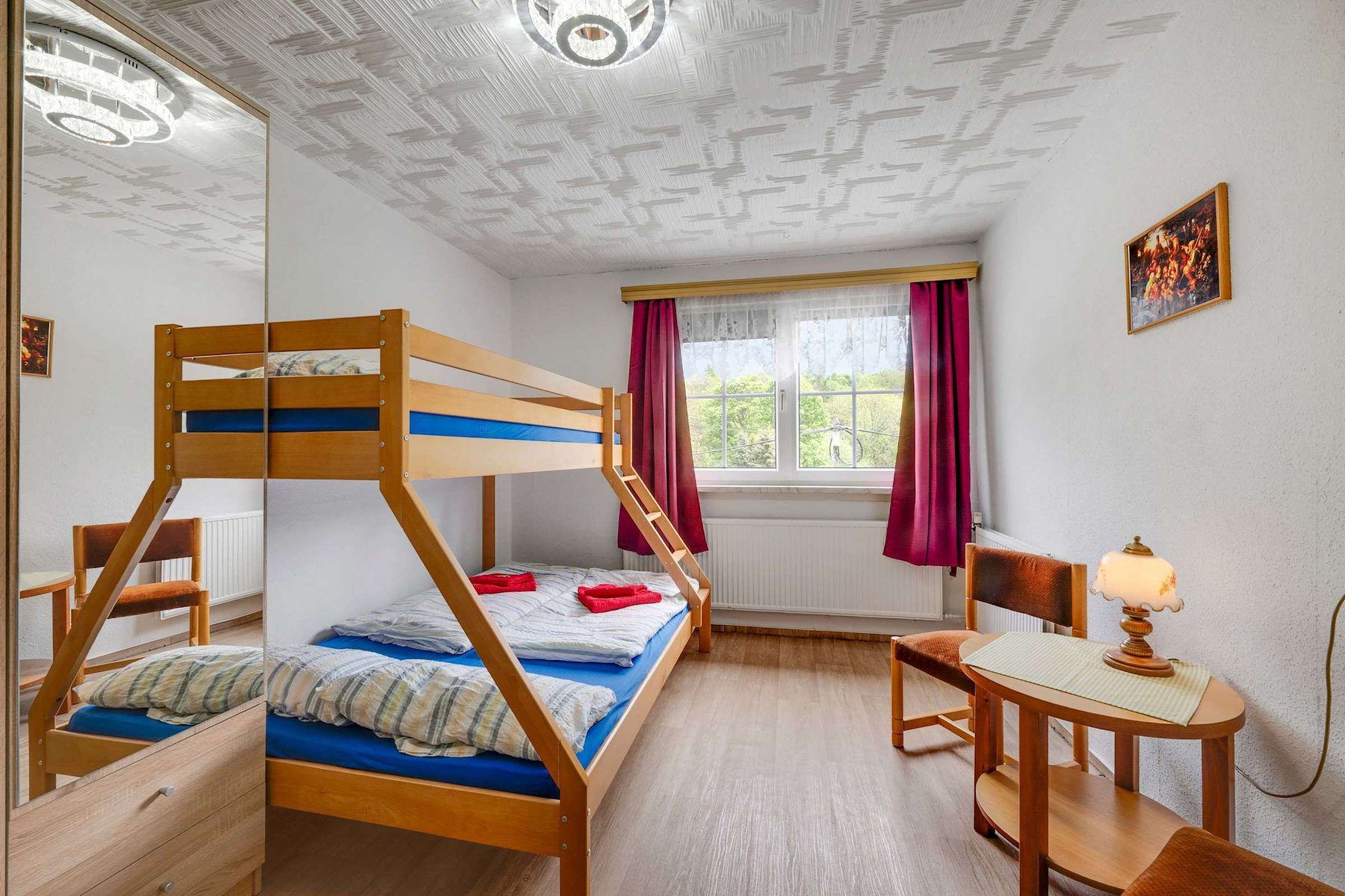 Spacious Room with sturdy Bunk Bed, Sitting Area, and Scenic Views—Ideal for both Sleep and Downtime.