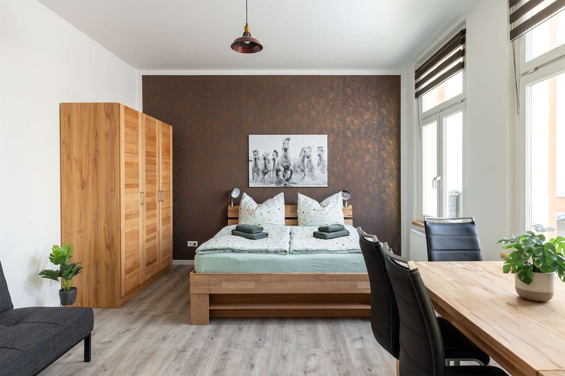 Living Area with a Double Bed, Closet, Dining Area & Sofa Bed