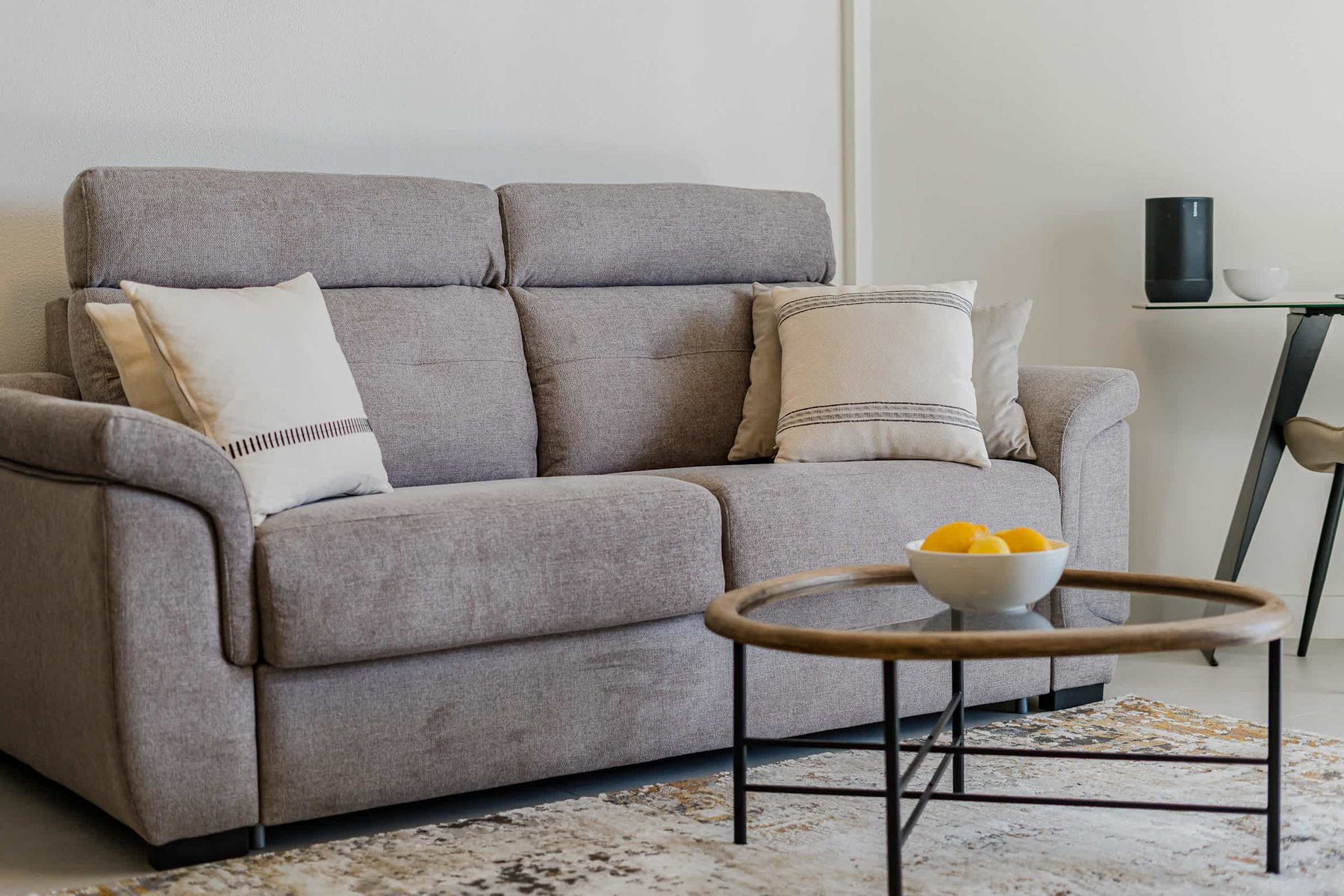Cozy Designer Sofa with Plush Cushions, Contemporary Coffee Table & Neutral Tones