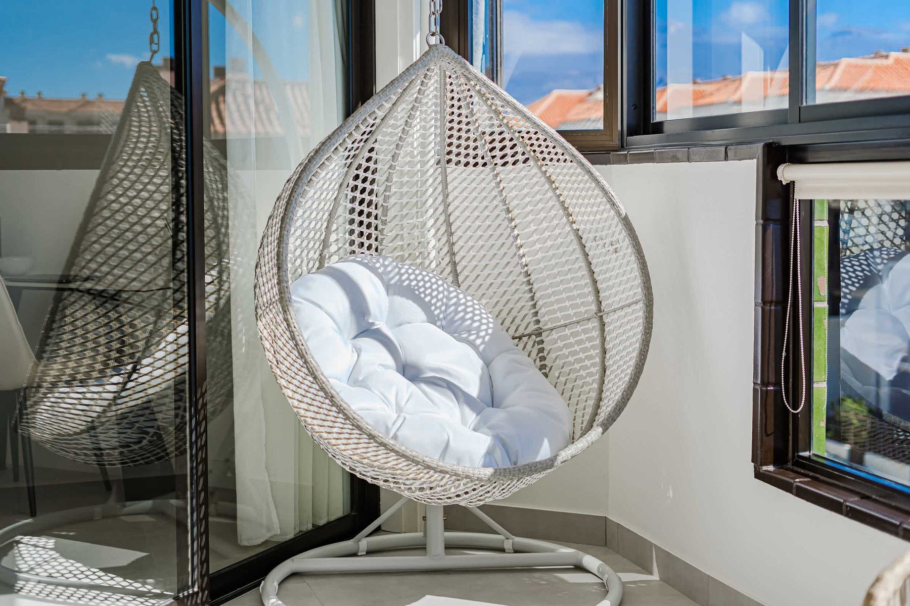 Stylish Hanging Egg Chair with Plush Cushioning and Ocean View — A Peaceful Spot to Unwind in Comfort