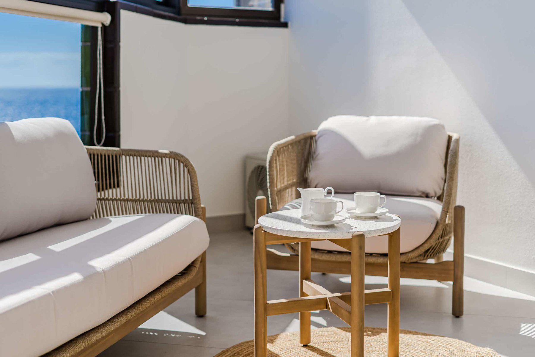 Chic Outdoor Lounge Setting with Sofa, Armchair & Coffee Table — Perfect for Morning Tea or Relaxed Evenings by the Sea