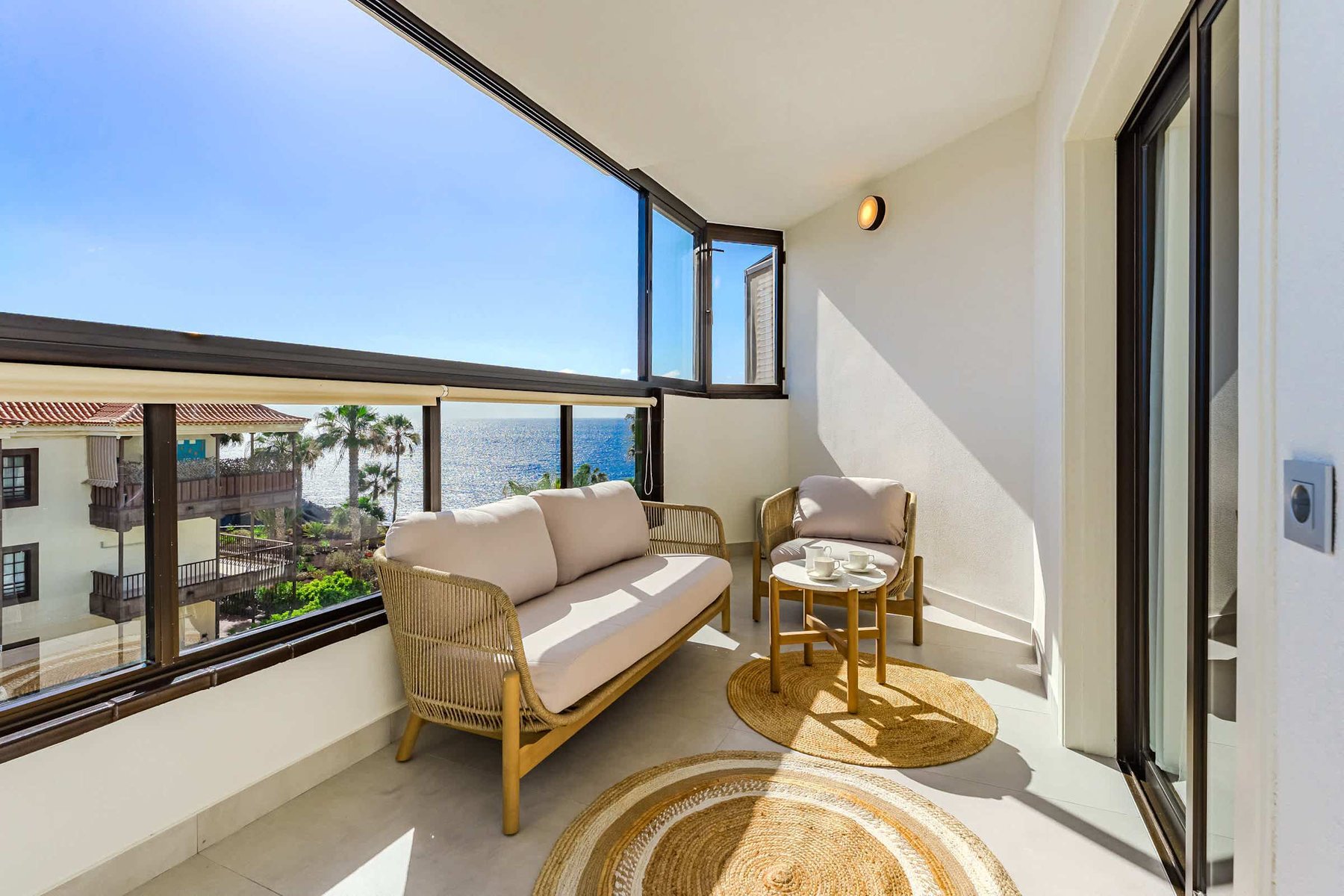 Enclosed Private Terrace with Lounge Seating and Sweeping Atlantic Ocean Views — Ideal for Morning Coffee or Sunset Moments