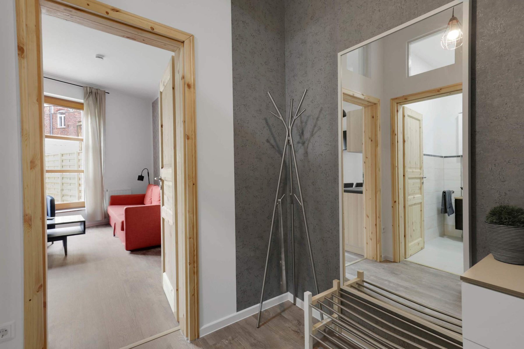 Stylish Entryway with Coat Rack & Mirror | Easy Access to Living Room, Kitchen & Bath