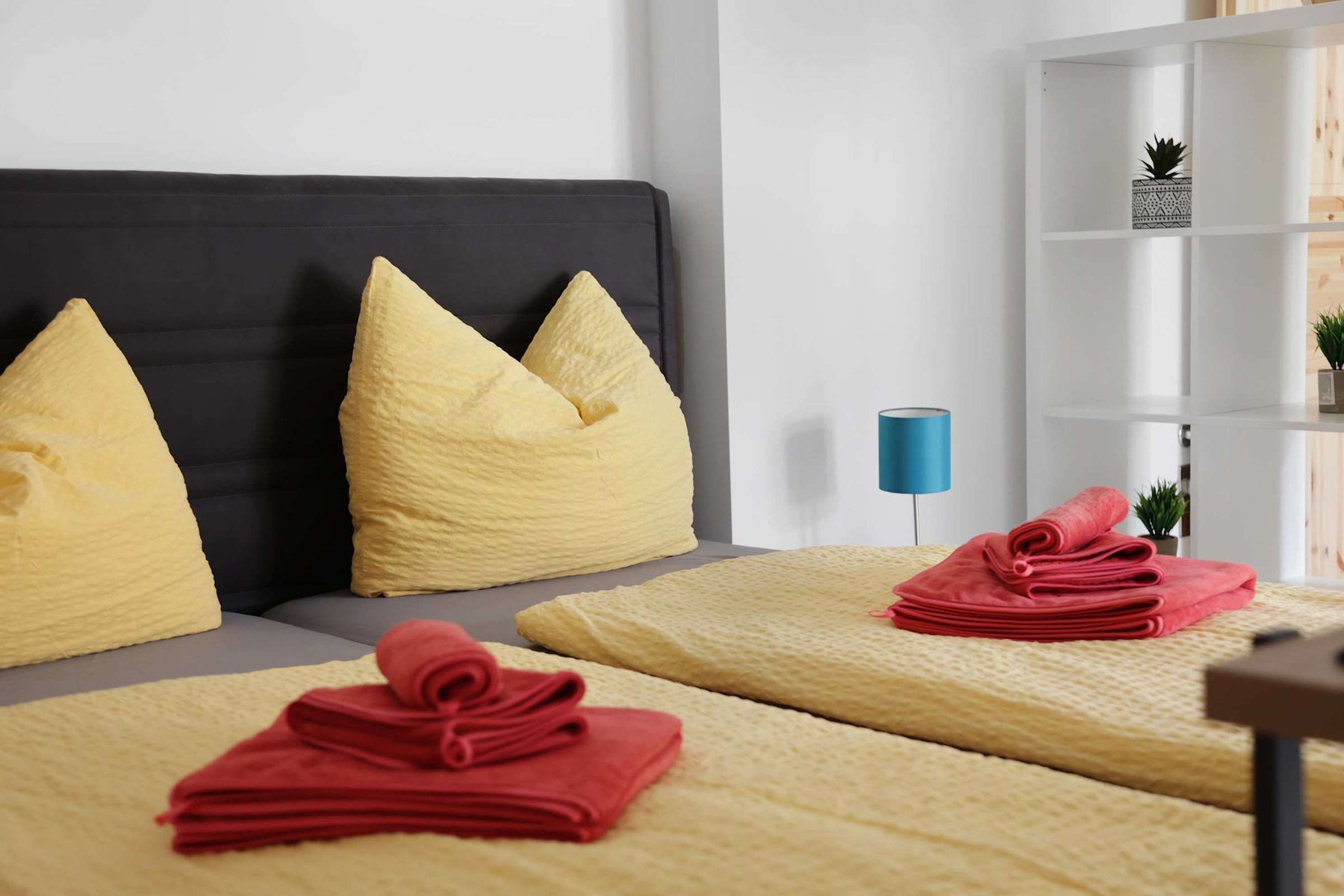 Soft bedding details | Cozy pillows and towels for a warm welcome