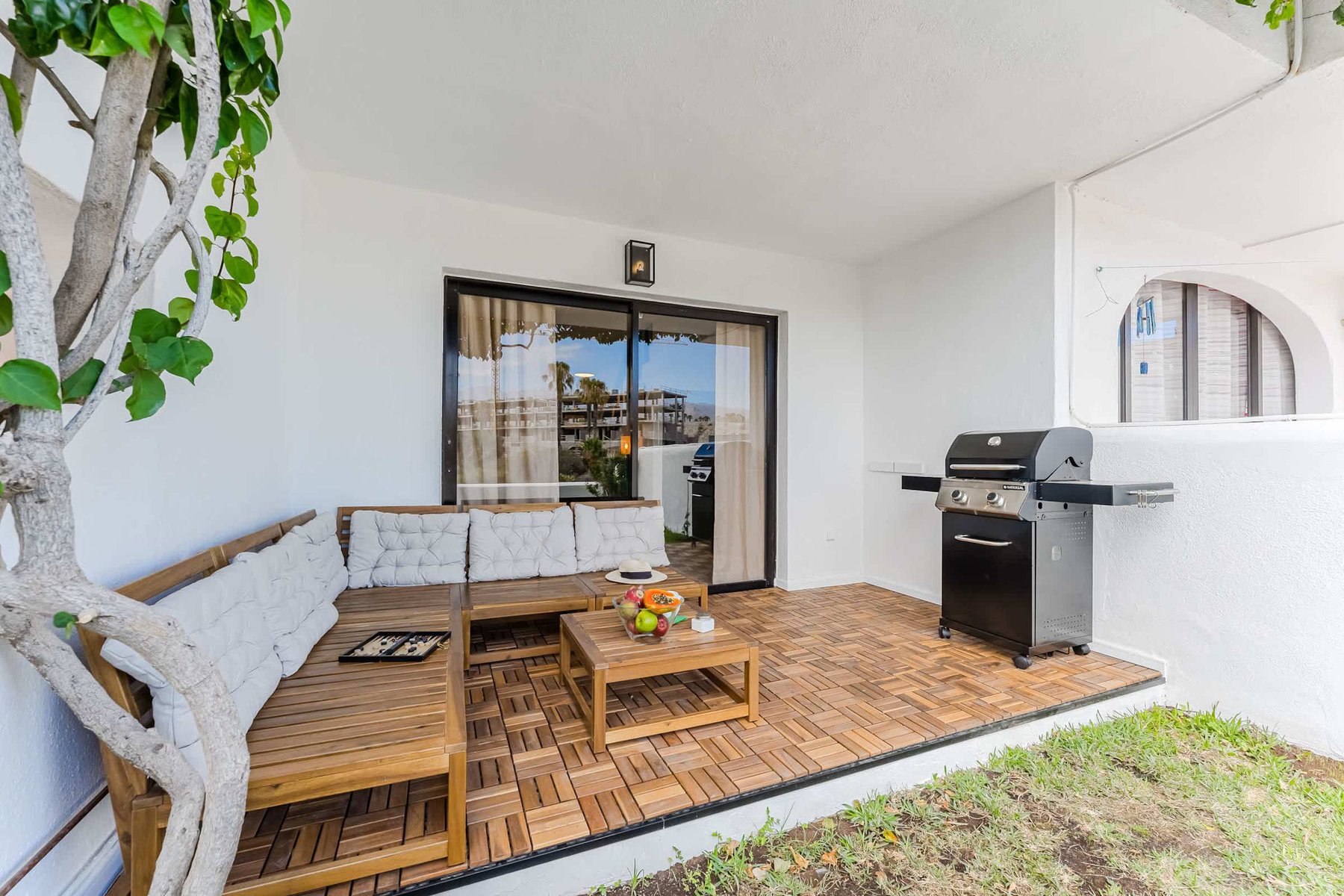 Shaded Garden Terrace with Comfy Lounge — A Breezy Spot to Enjoy Fruit, Play Games, or Unwind Surrounded by Nature