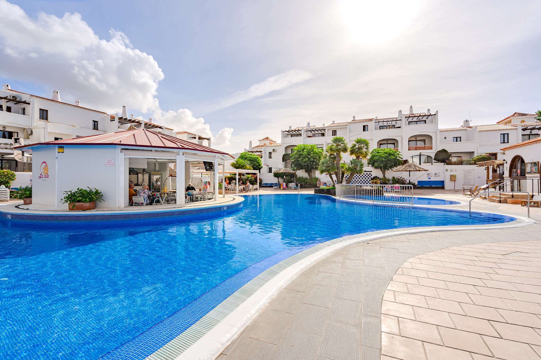 Large Resort Pool with Pool Bar — Enjoy Sun-Soaked Swims, Lounging, and Light Bites Just Steps from Your Door