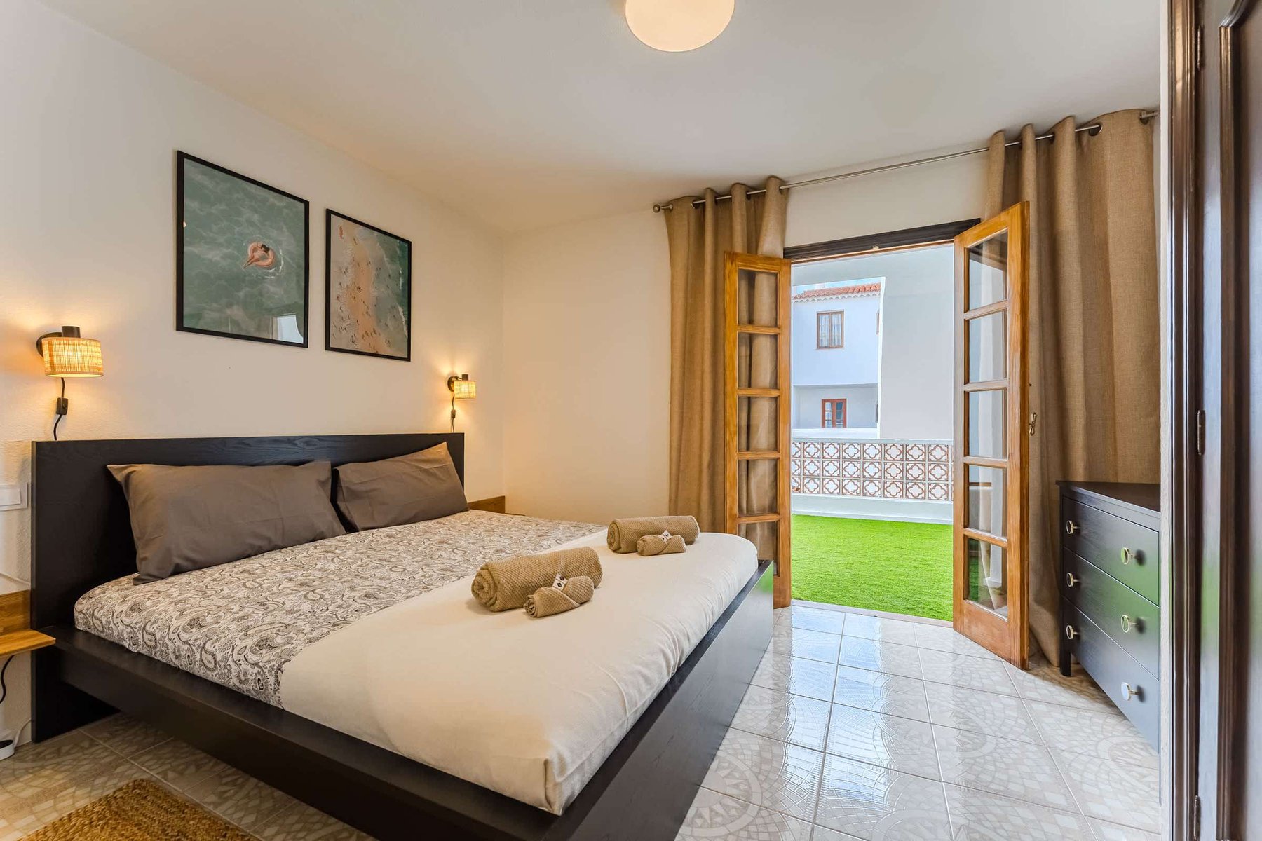 Master Bedroom with Views — Wake Up to Natural Light & Step Straight Out to a Private Green Space Through French Doors
