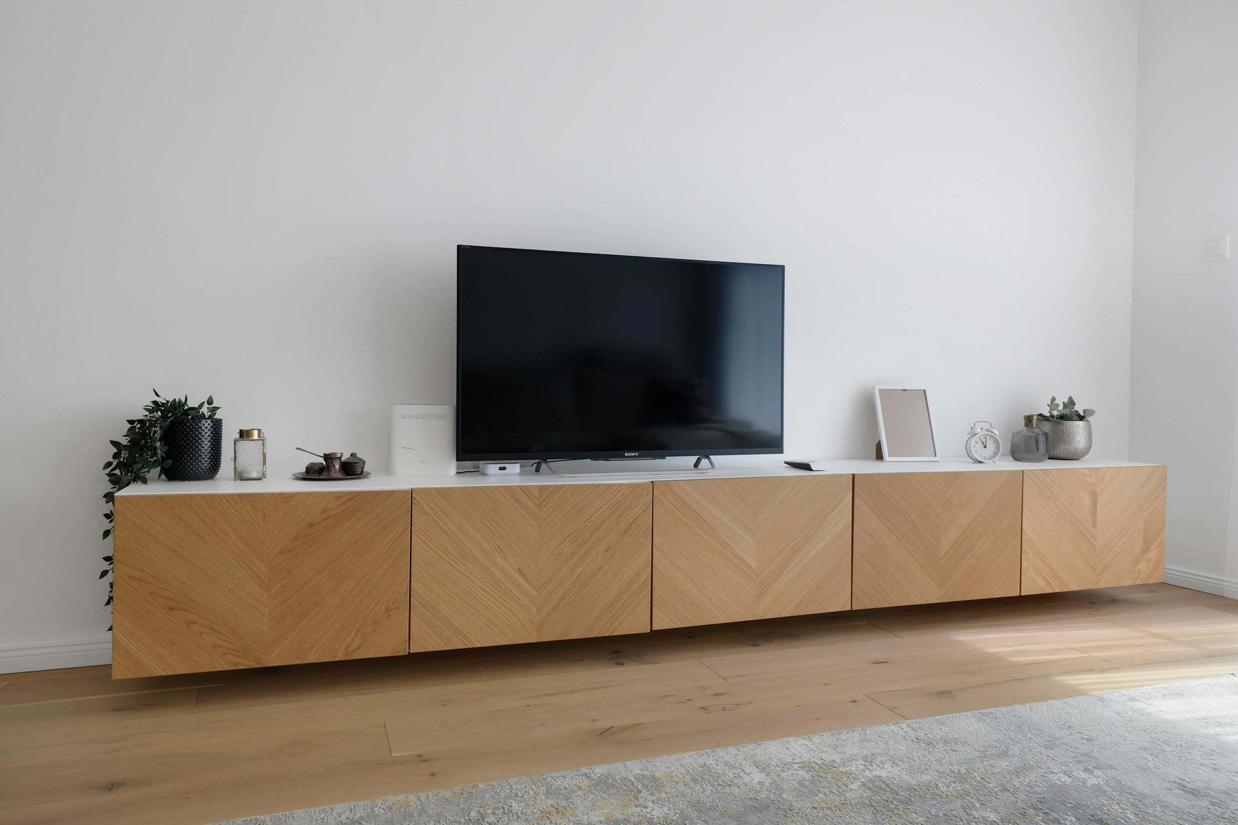 Modern Entertainment Setup with Smart TV and Decor Accents