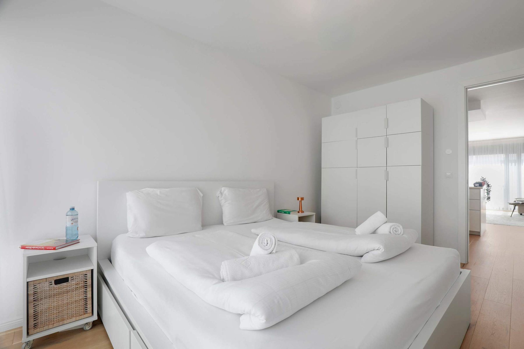 Crisp White Bedding & Twin Setup — Fresh, Hotel-Style Ambience for Work, Relaxation, or Extended Stays