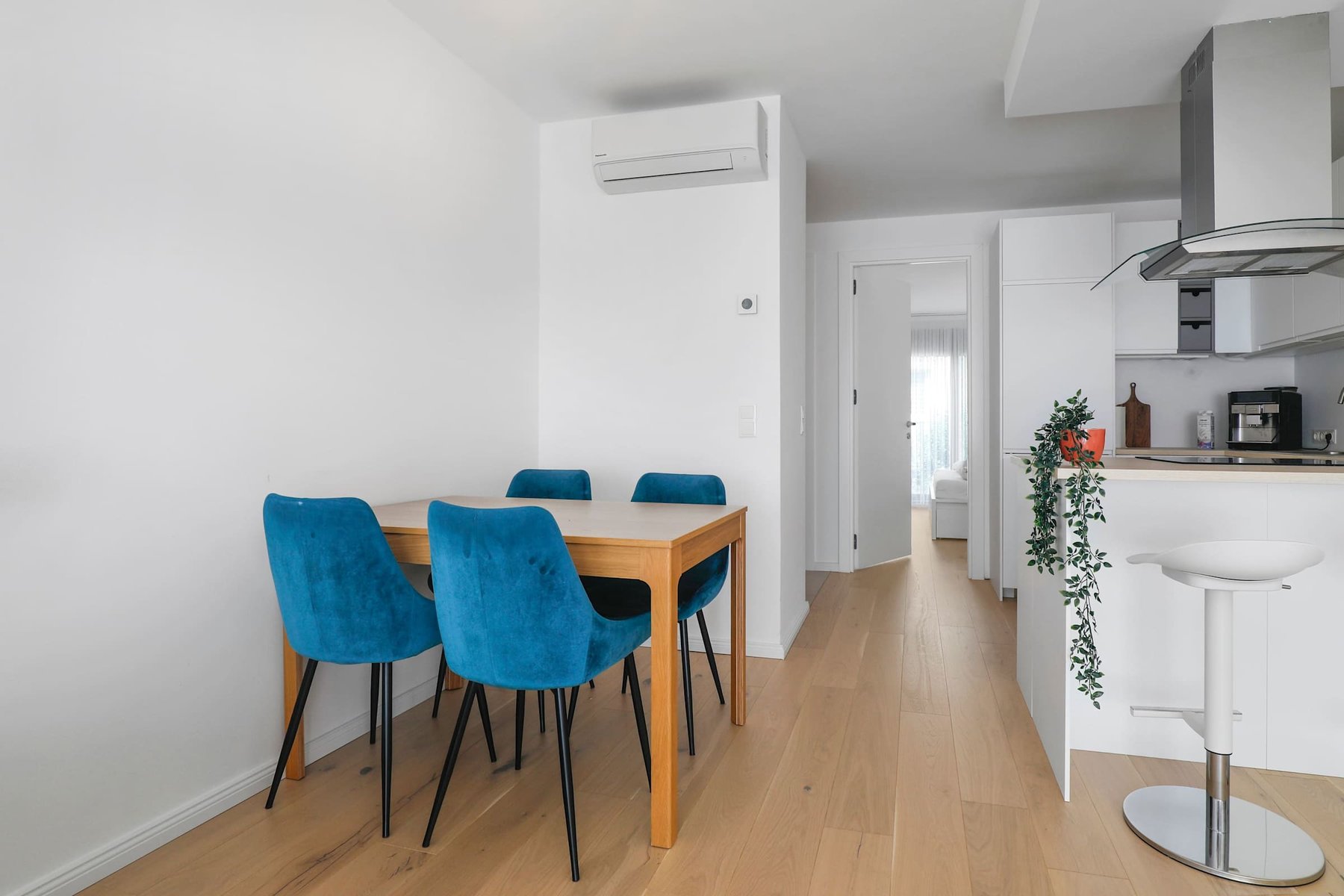 Cozy Dining Area with Velvet Chairs and a Minimalist Aesthetic