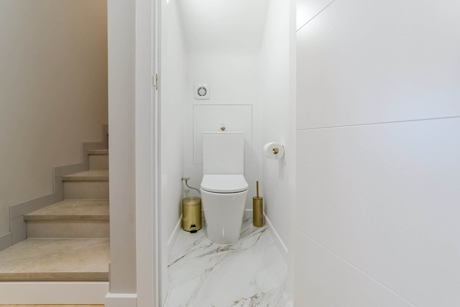 Compact WC with Golden Touches – Modern, Sleek & Functional