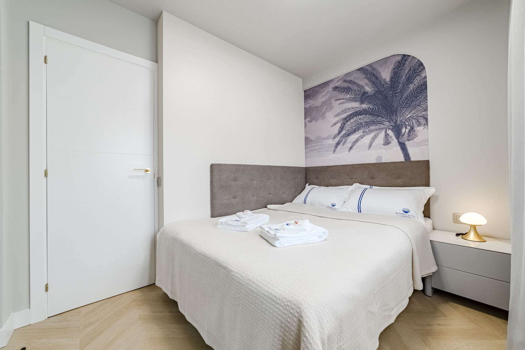 Stylish Bedroom with Palm-Inspired Accent Wall – Wake Up in Coastal Elegance