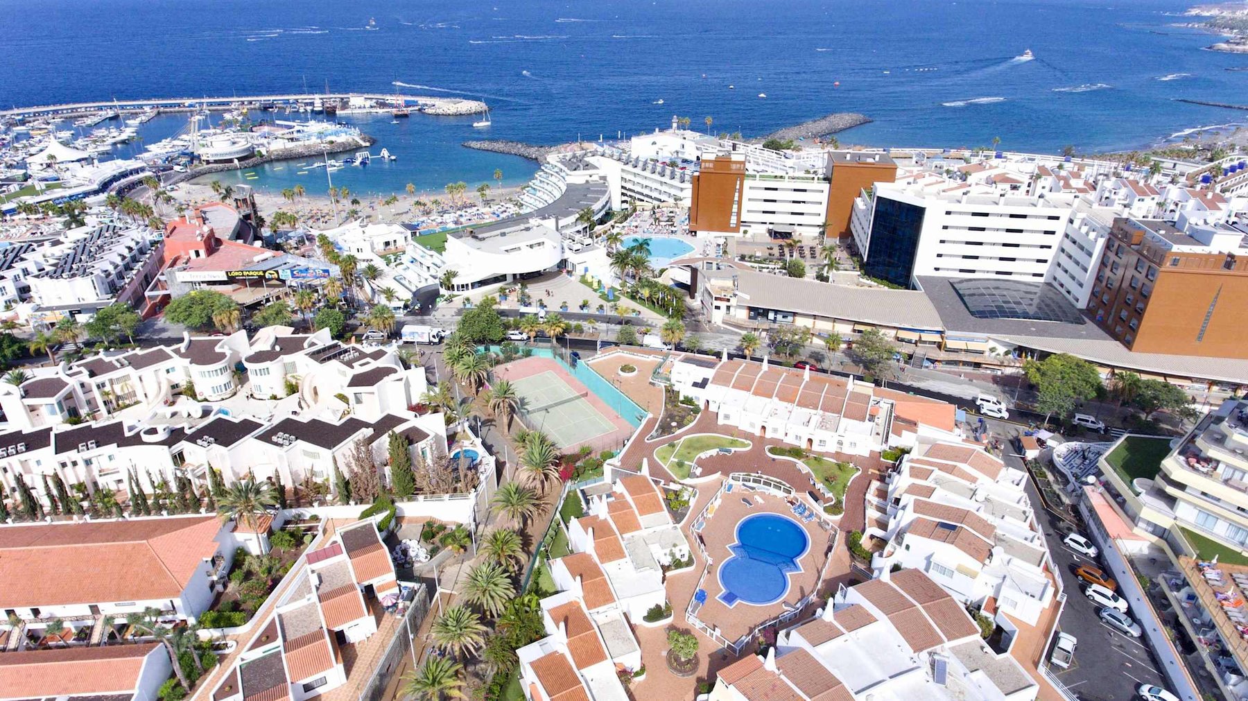 Stunning Aerial View of the Coastline & Residence – Your Luxury Stay Surrounded by Ocean and Resort Amenities