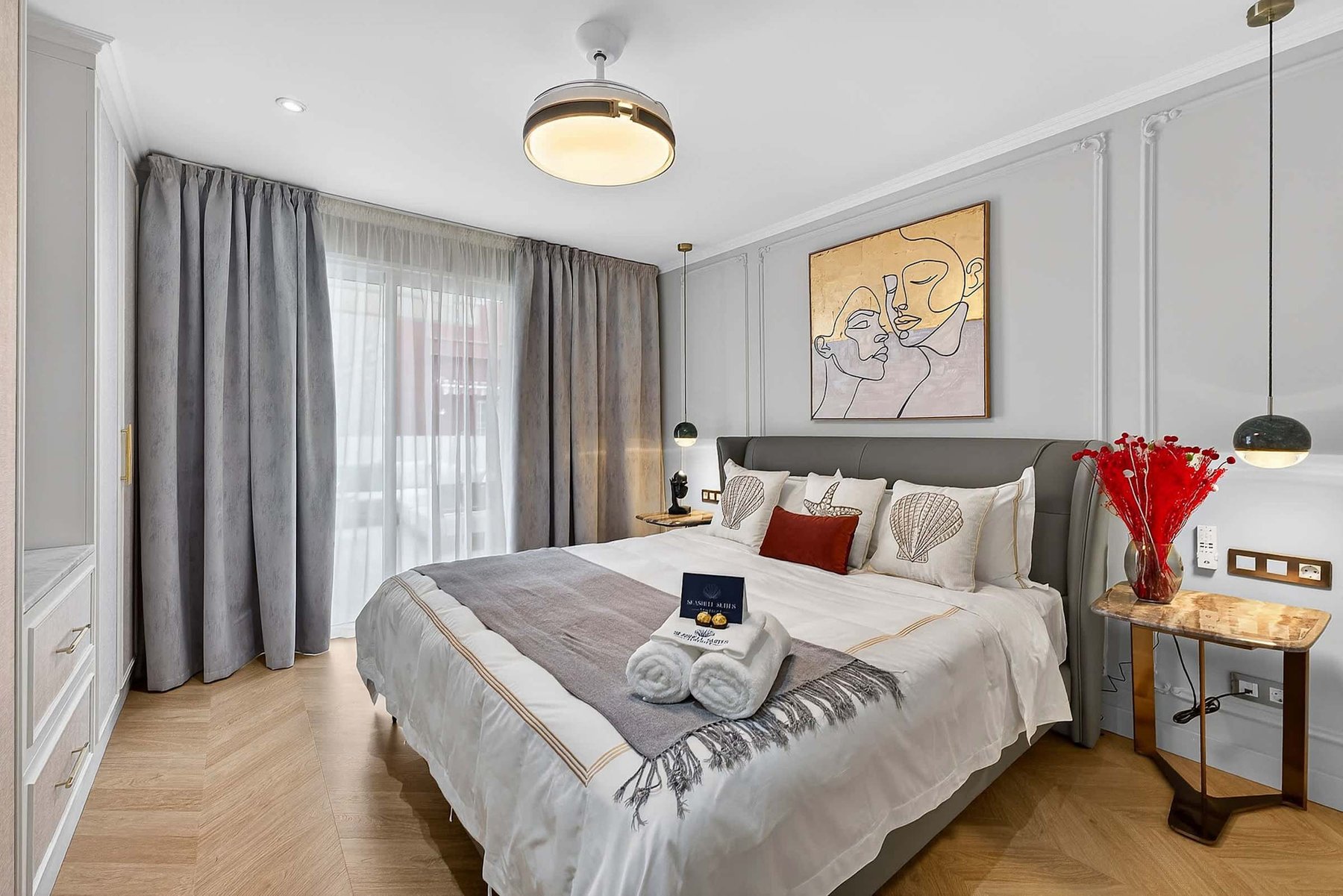 Artfully Curated Master Suite with King Bed — Sleep Under Elegant Lighting in a Space Designed for Serenity and Sophistication