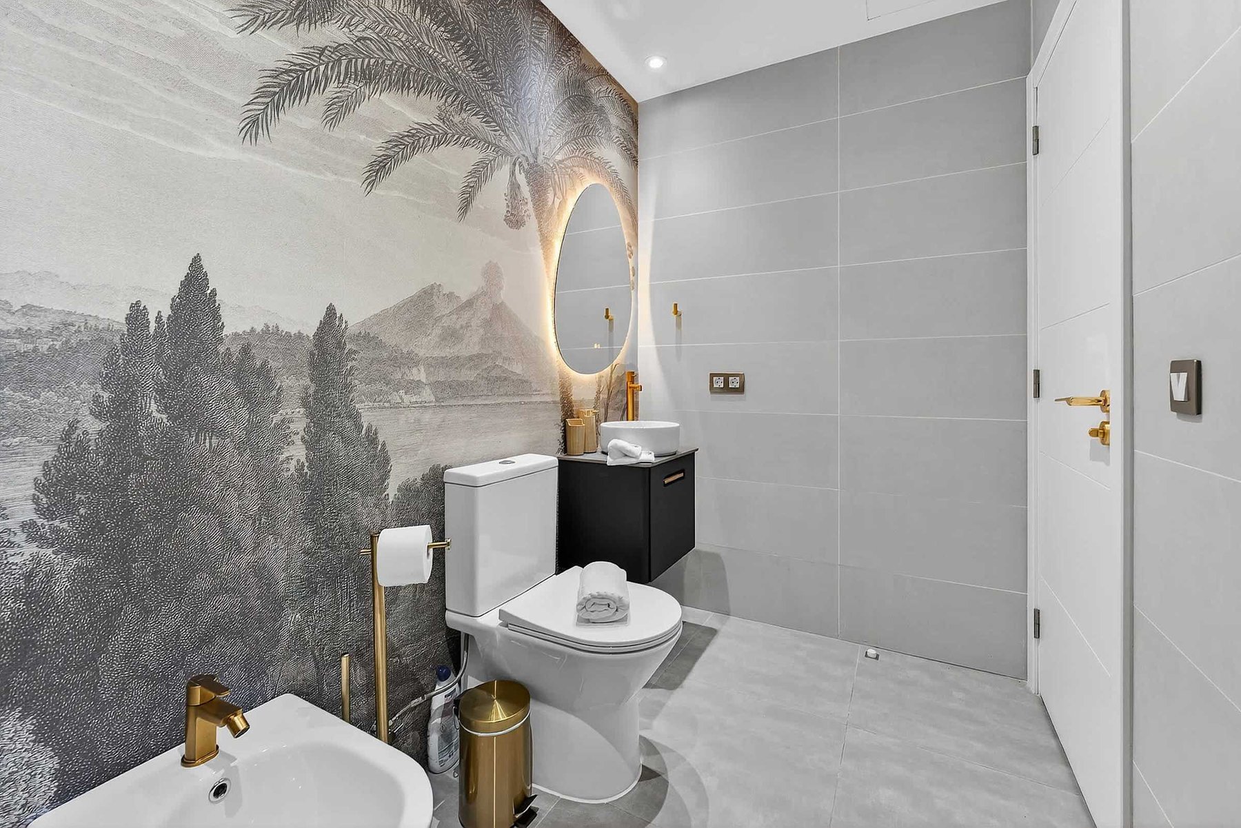 Spa-Inspired Bathroom with Scenic Mural and Gold Accents — Refresh in a Walk-In Rain Shower Framed by Mediterranean Elegance