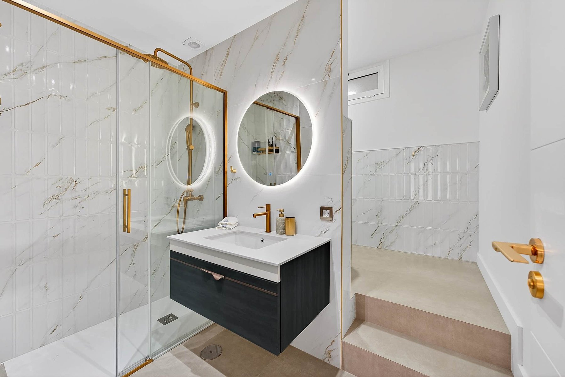 Chic Ensuite with Rainfall Shower – Golden Hardware and Soft Lighting for a Boutique Spa Experience