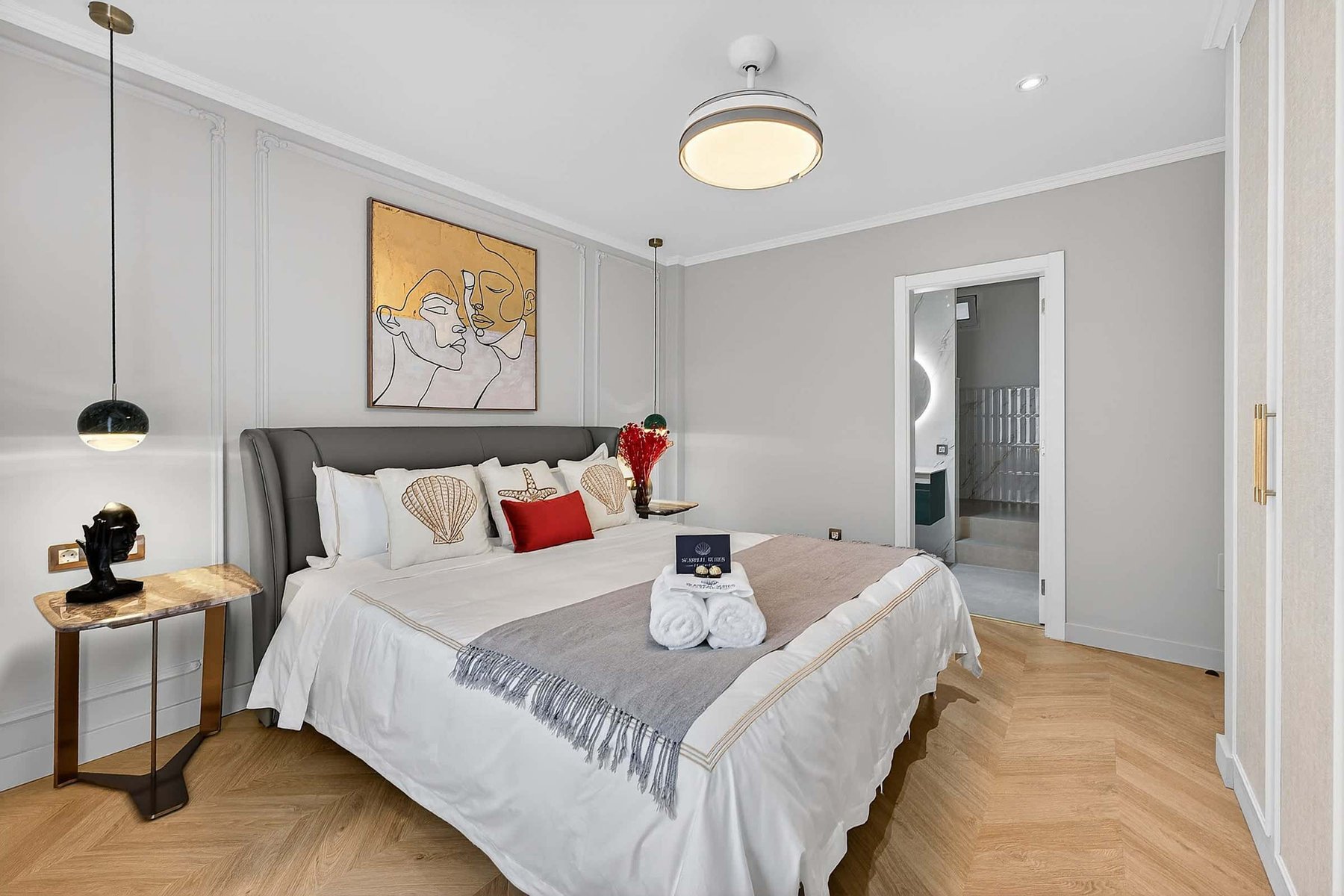 Artfully Curated Master Suite with King Bed — Sleep Under Elegant Lighting in a Space Designed for Serenity and Sophistication