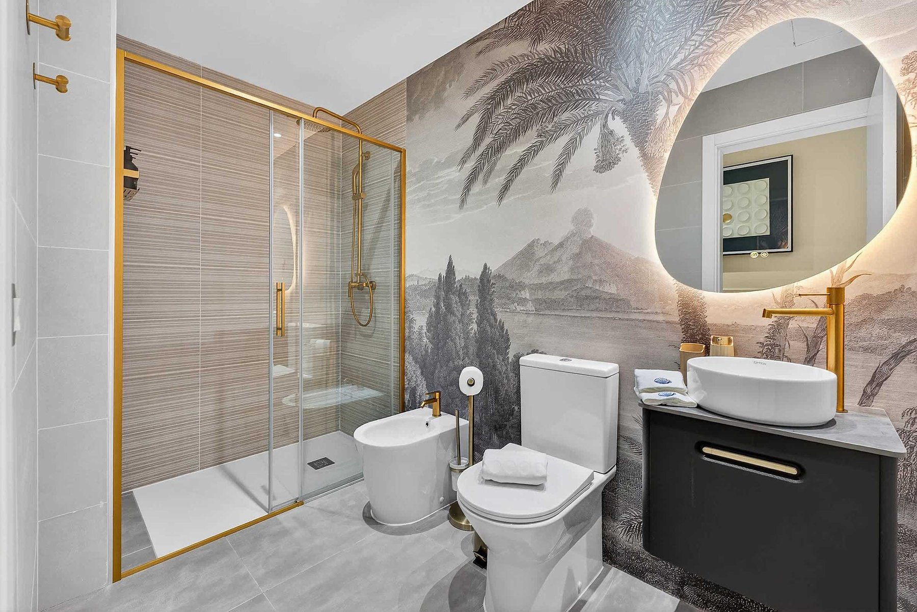 Spa-Inspired Bathroom with Scenic Mural and Gold Accents — Refresh in a Walk-In Rain Shower Framed by Mediterranean Elegance