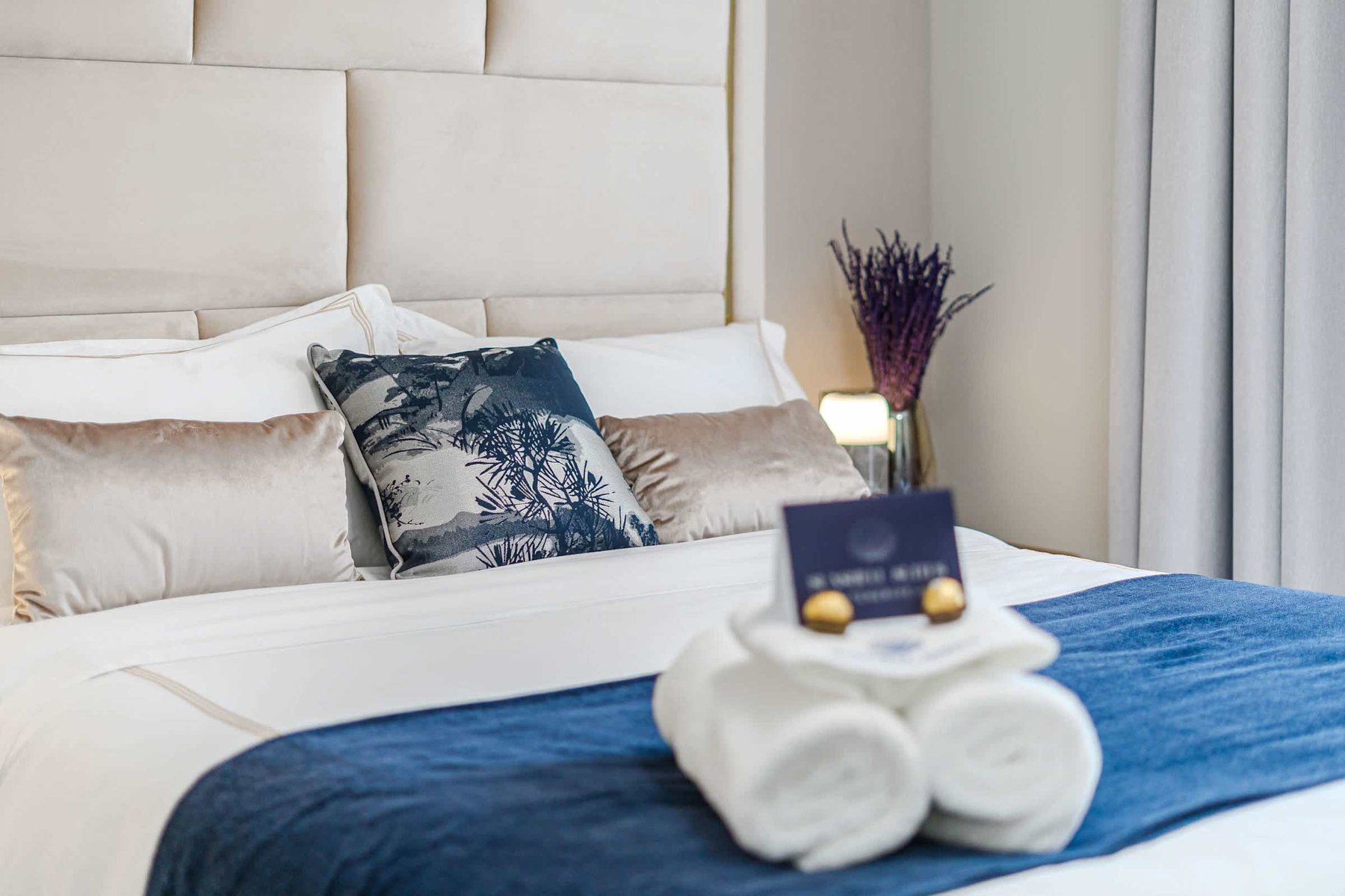 Tranquil Second Bedroom with Sea-Inspired Tones — Wake Refreshed in a Coastal Retreat with Soft Drapes and Plush Bedding