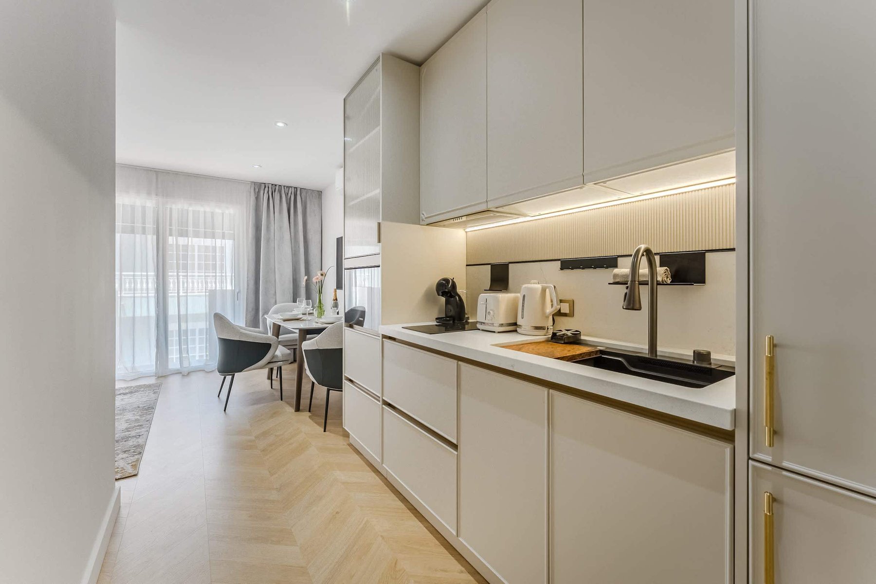Seamless Kitchen & Dining Flow – Fully Equipped with Premium Appliances and Sleek Finishes